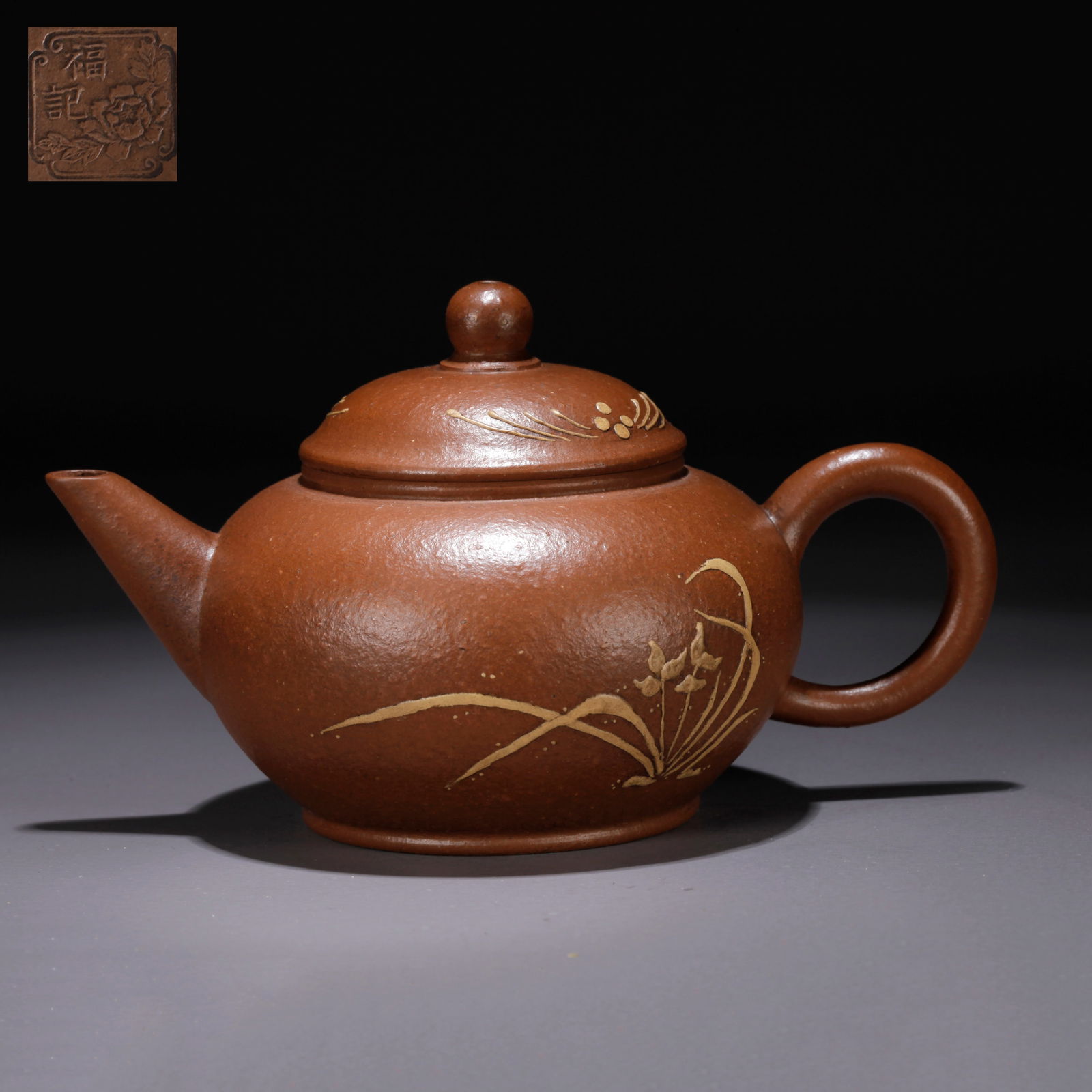 A PURPLE CLAY (ZISHA) FLORAL-PATTERNED TEAPOT: Purple Clay (Zisha) Floral-Patterned Teapot