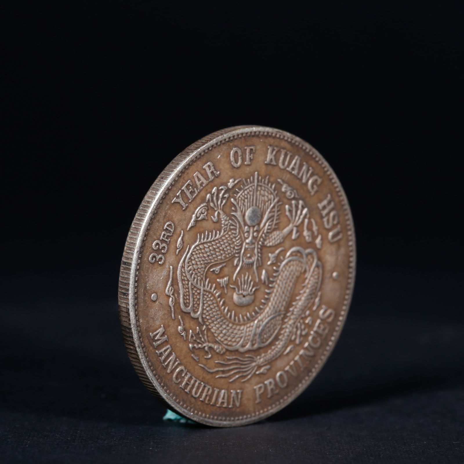 A SILVER DOLLAR COIN - 3