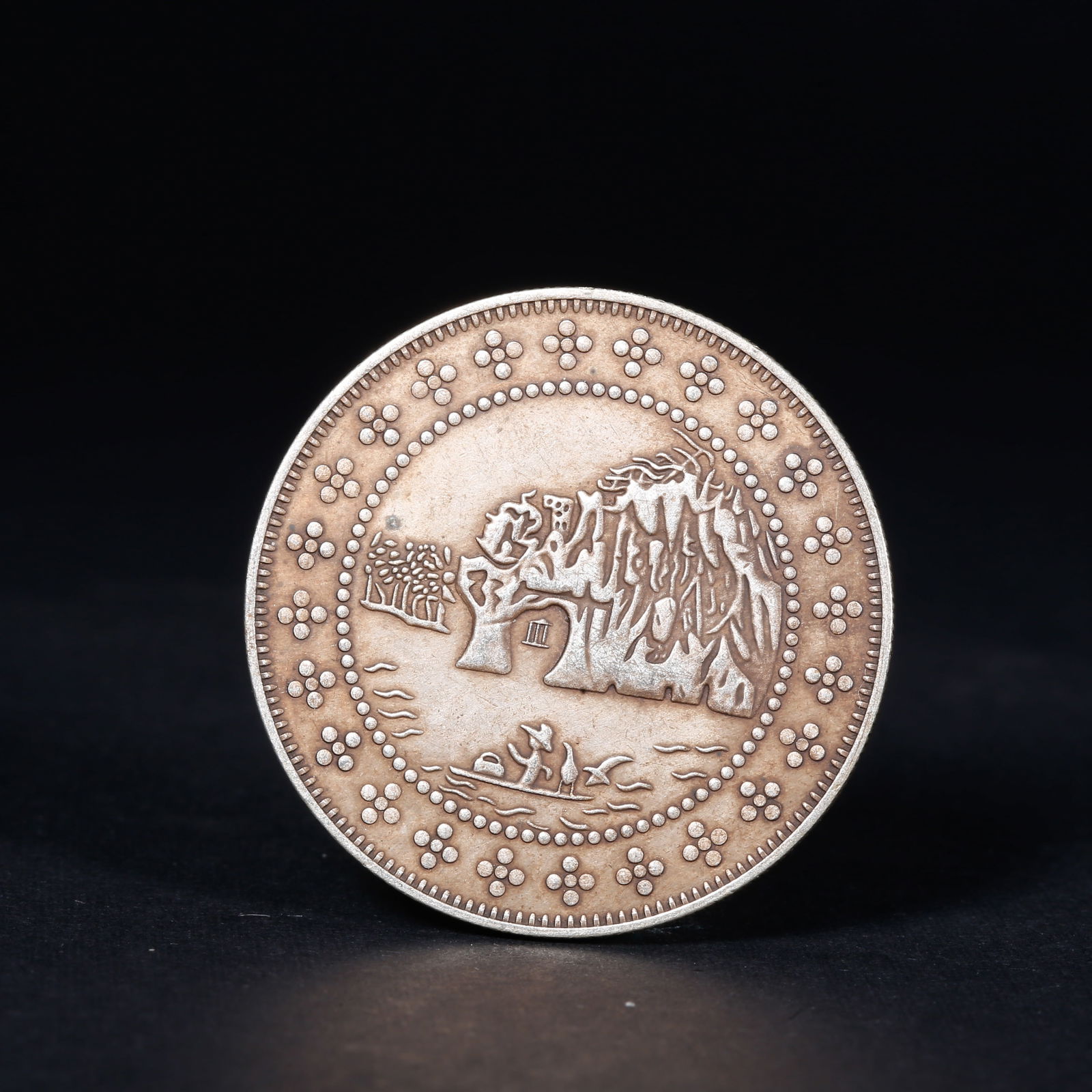 A SILVER DOLLAR COIN: One Silver dollar Coin