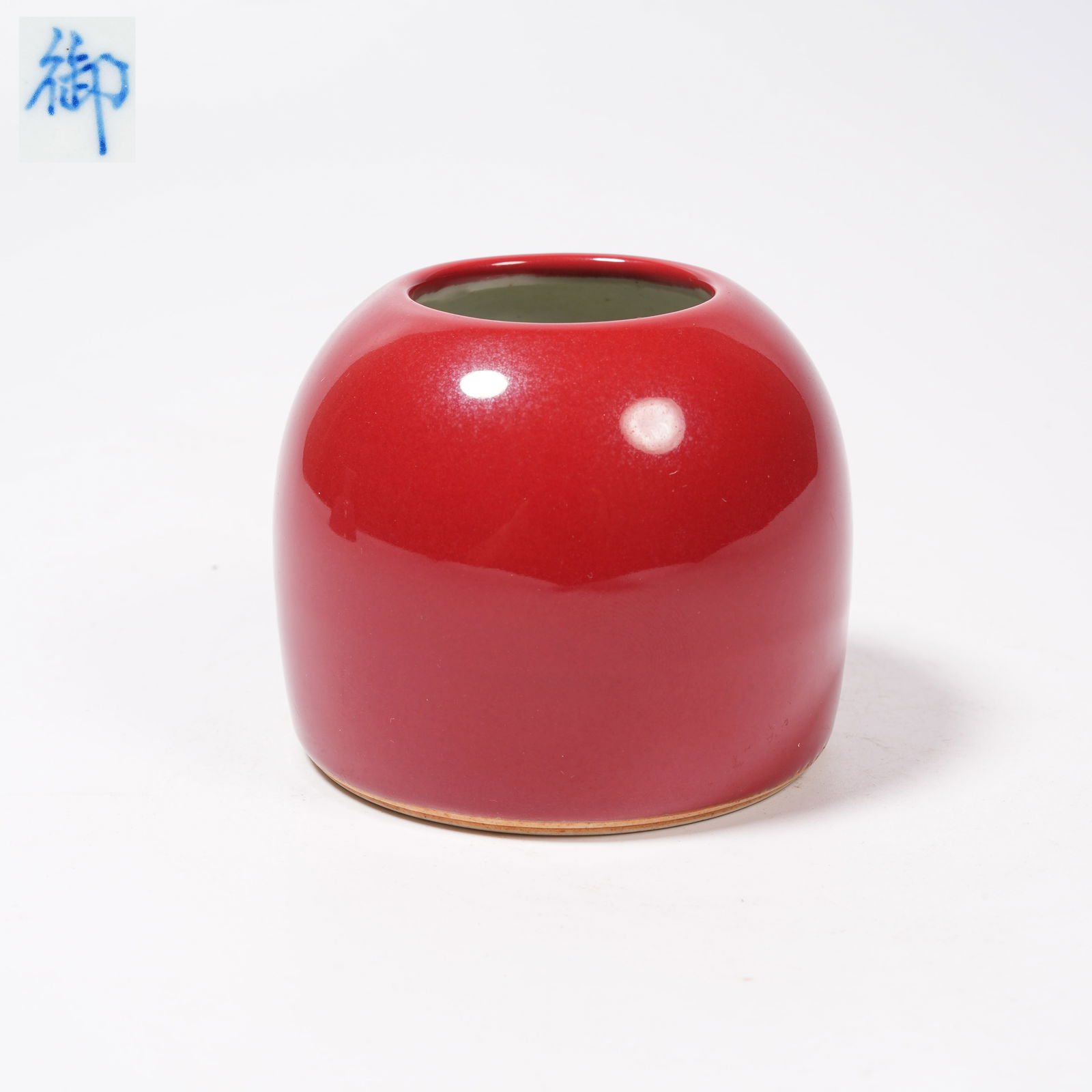 A CORAL-RED GLAZED HORSESHOE VASE: Coral-Red Glazed Horseshoe Vase