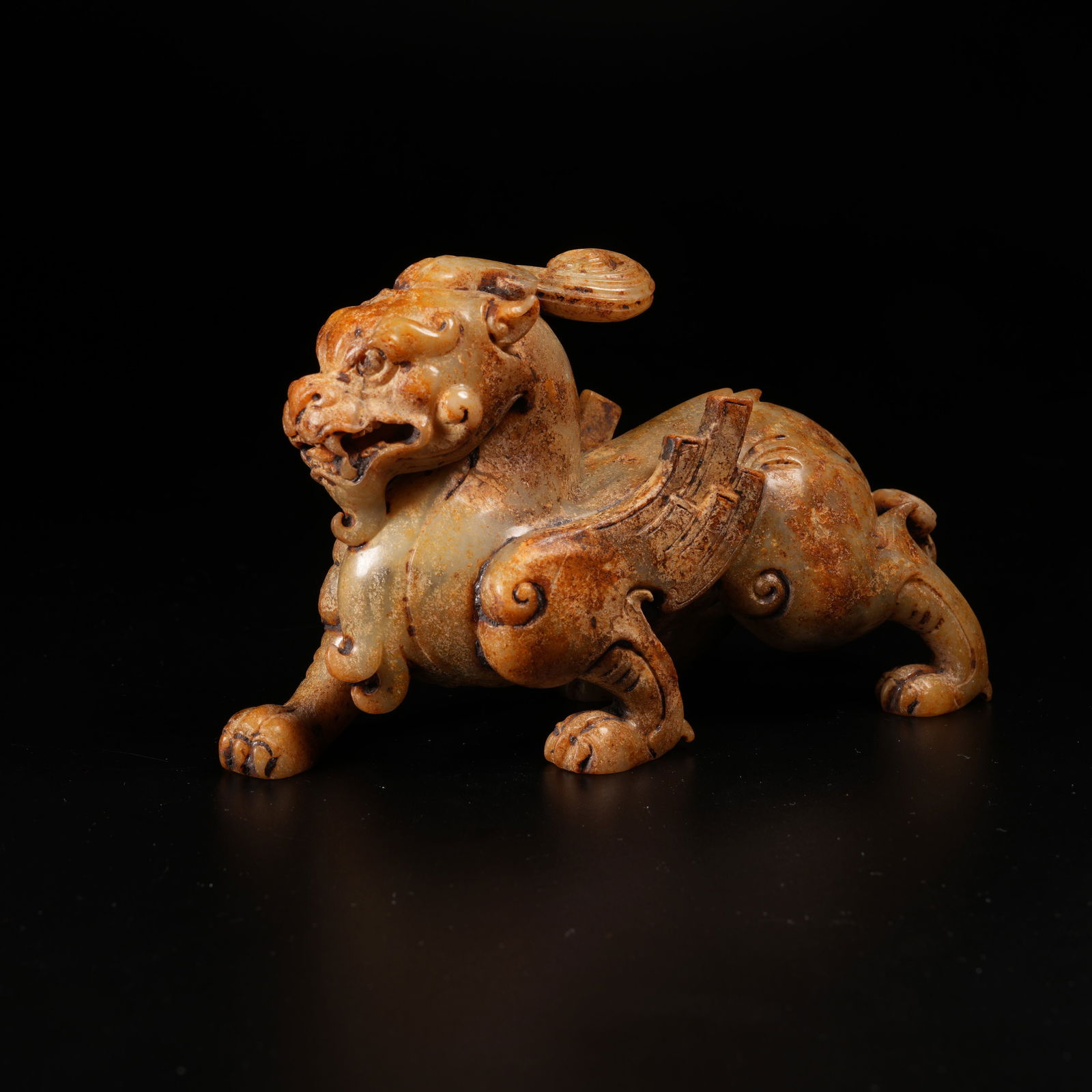 A AUSPICIOUS BEAST ORNAMENT IN ARCHAIC JADE: Auspicious Beast Ornament in Archaic Jade