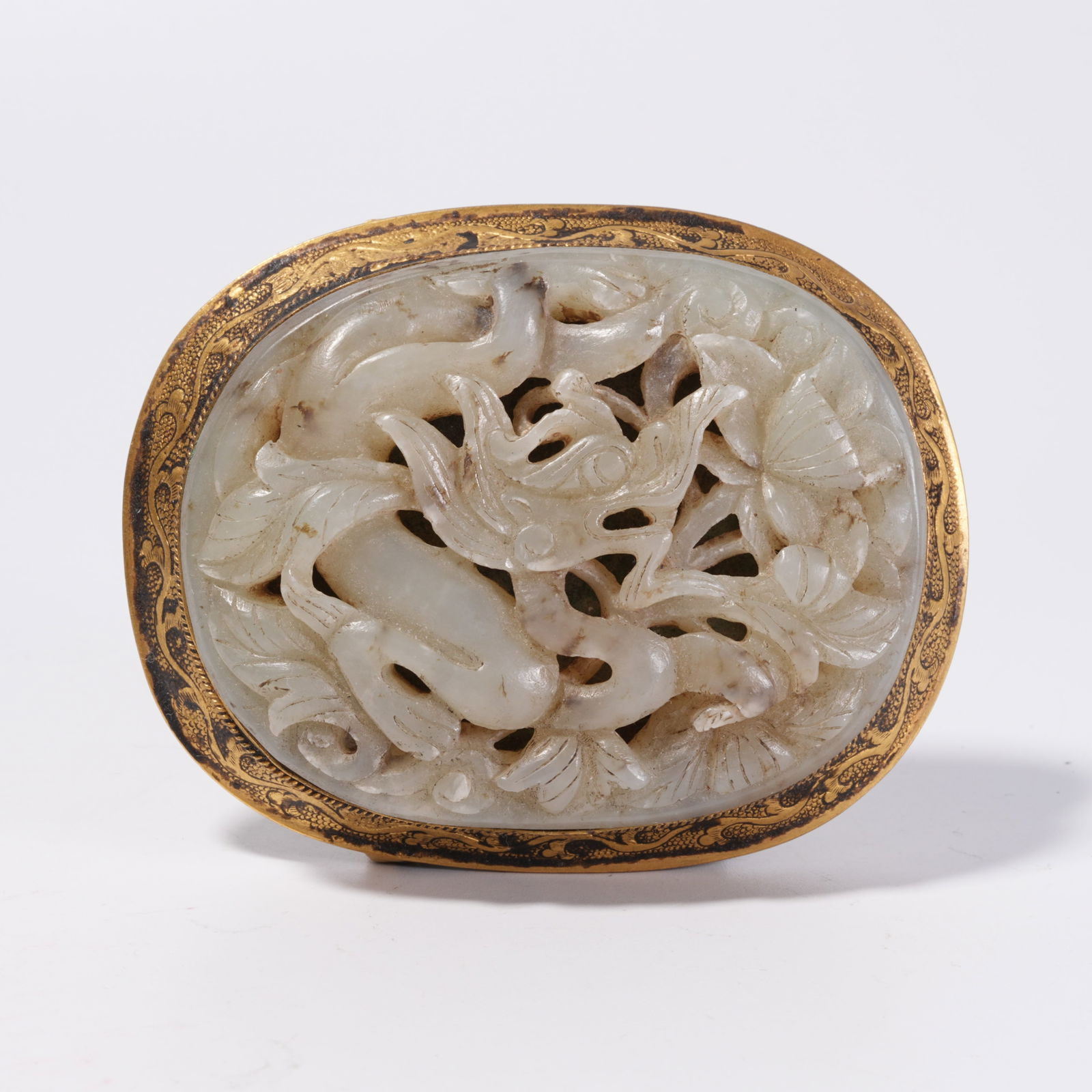 A GILDED BRONZE BELT BUCKLE INLAID WITH HETIAN JADE AND BEAST PATTERN: Gilded Bronze Belt Buckle Inlaid with Hetian Jade and Beast Pattern
