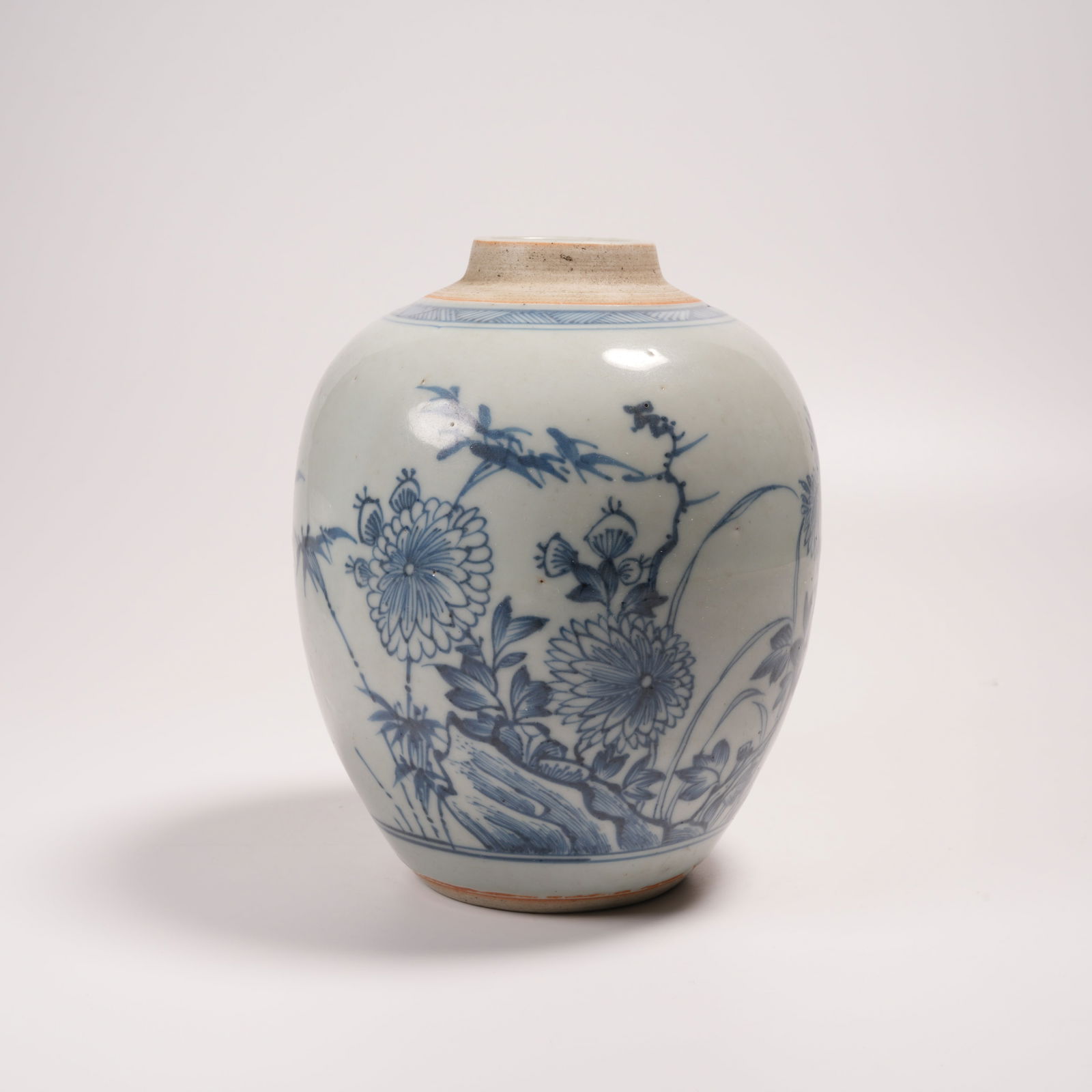 A BLUE-AND-WHITE JAR WITH FLOWER AND BIRD PATTERN: Blue-and-White Jar with Flower and Bird Pattern