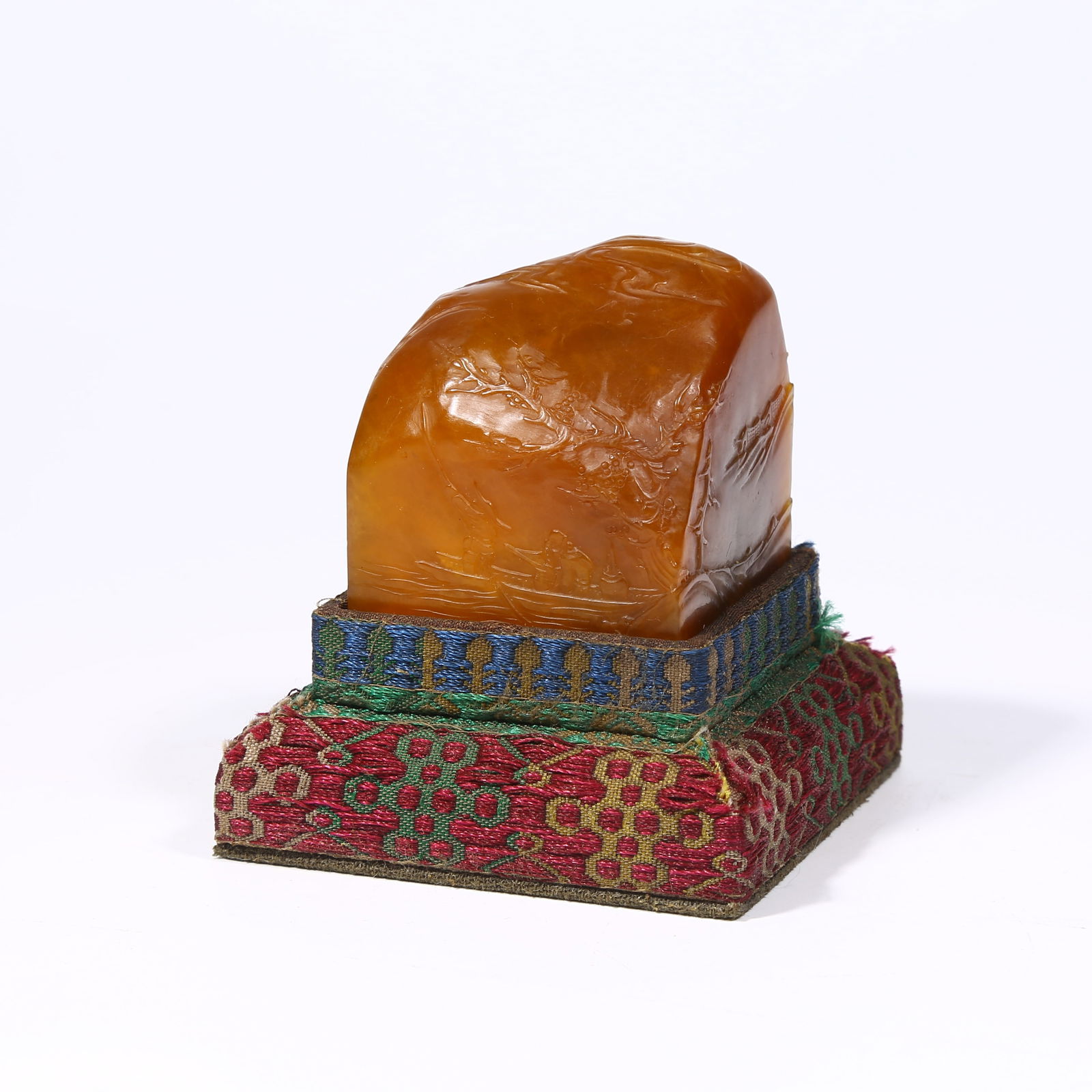 A SHOUSHAN TIANHUANG STONE SEAL WITH SHALLOW-RELIEF "FISHING FUN" DESIGN: Shoushan Tianhuang stone seal with shallow-relief "Fishing Fun" design