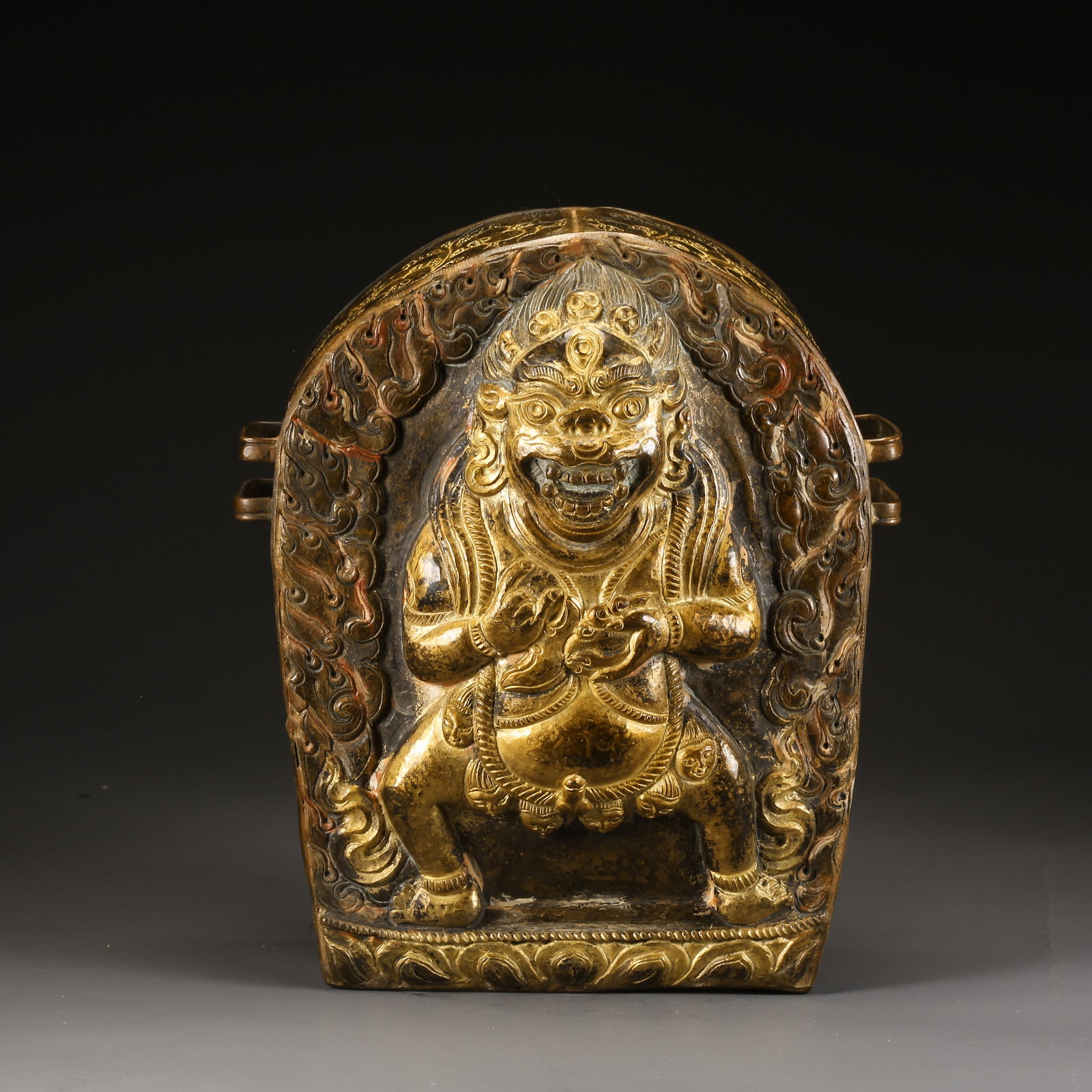 A PARTIALLY GILDED BRONZE BLACK JAMBHALA BOX: Partially gilded bronze Black Jambhala box