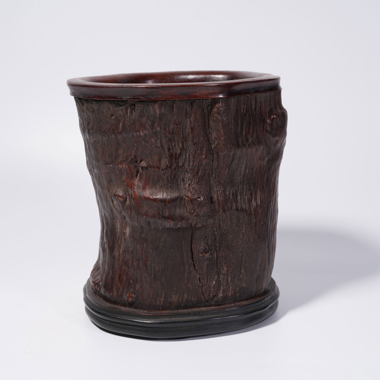 A HUANGHUALI WOOD BRUSH POT CARVED IN TREE BURL FORM: Huanghuali Wood Brush Pot Carved in Tree Burl Form
