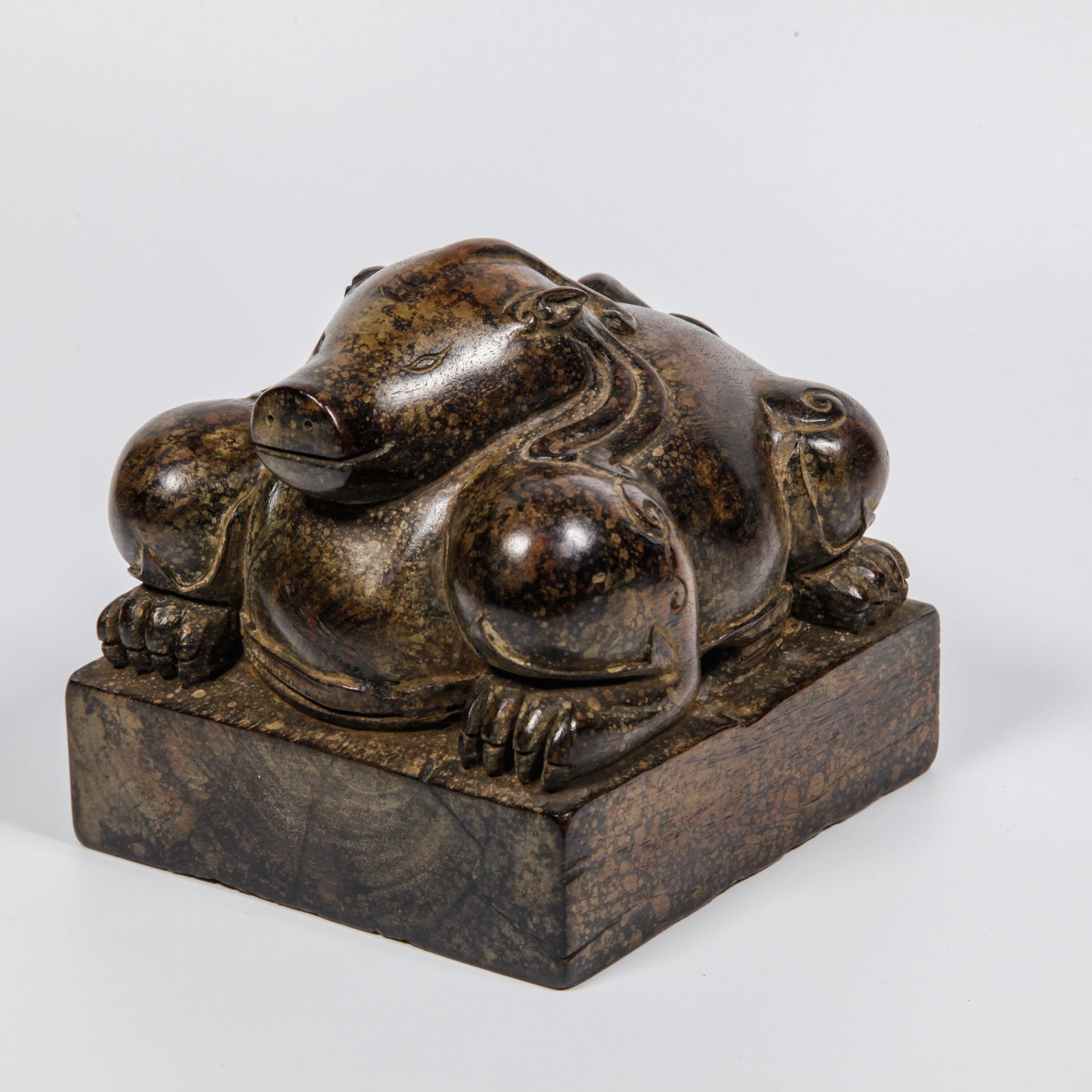 A HUANGHUALI WOOD CARVED AUSPICIOUS BEAST-HEAD SEAL: Huanghuali Wood Carved Auspicious Beast-Head Seal