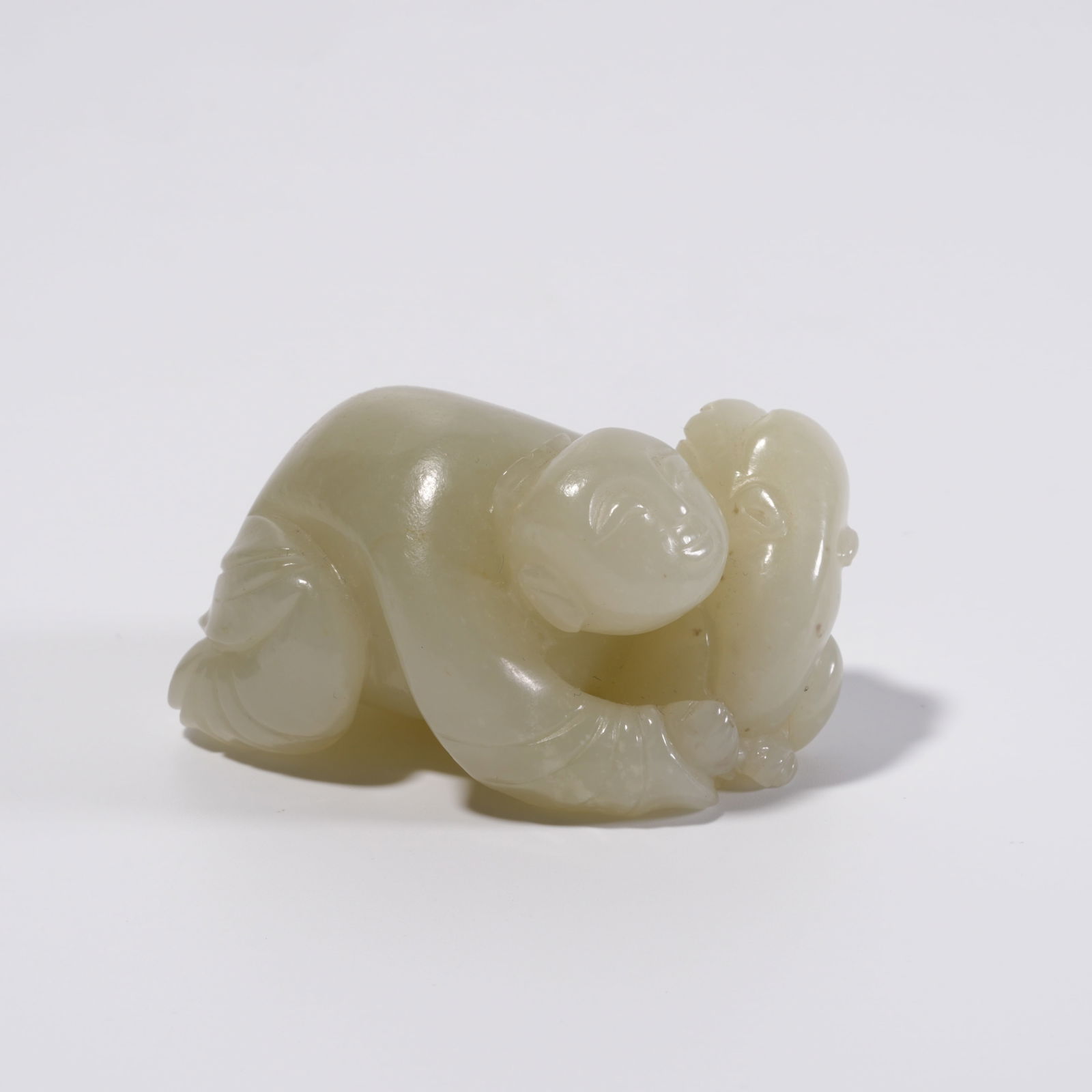 A HETIAN JADE CHILD FIGURE ORNAMENT (1 of 9)