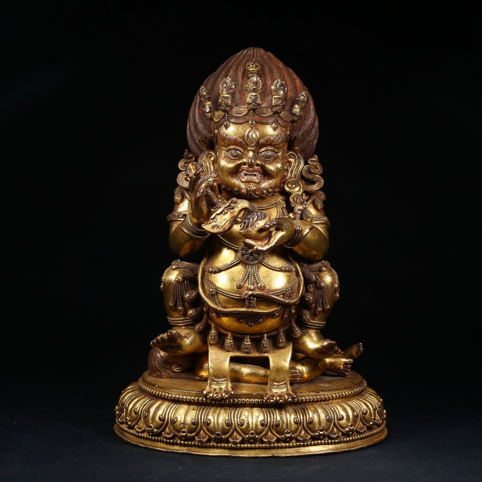 A GILT BRONZE TWO-ARMED MAHAKALA STATUE: Gilt Bronze Two-Armed Mahakala Statue