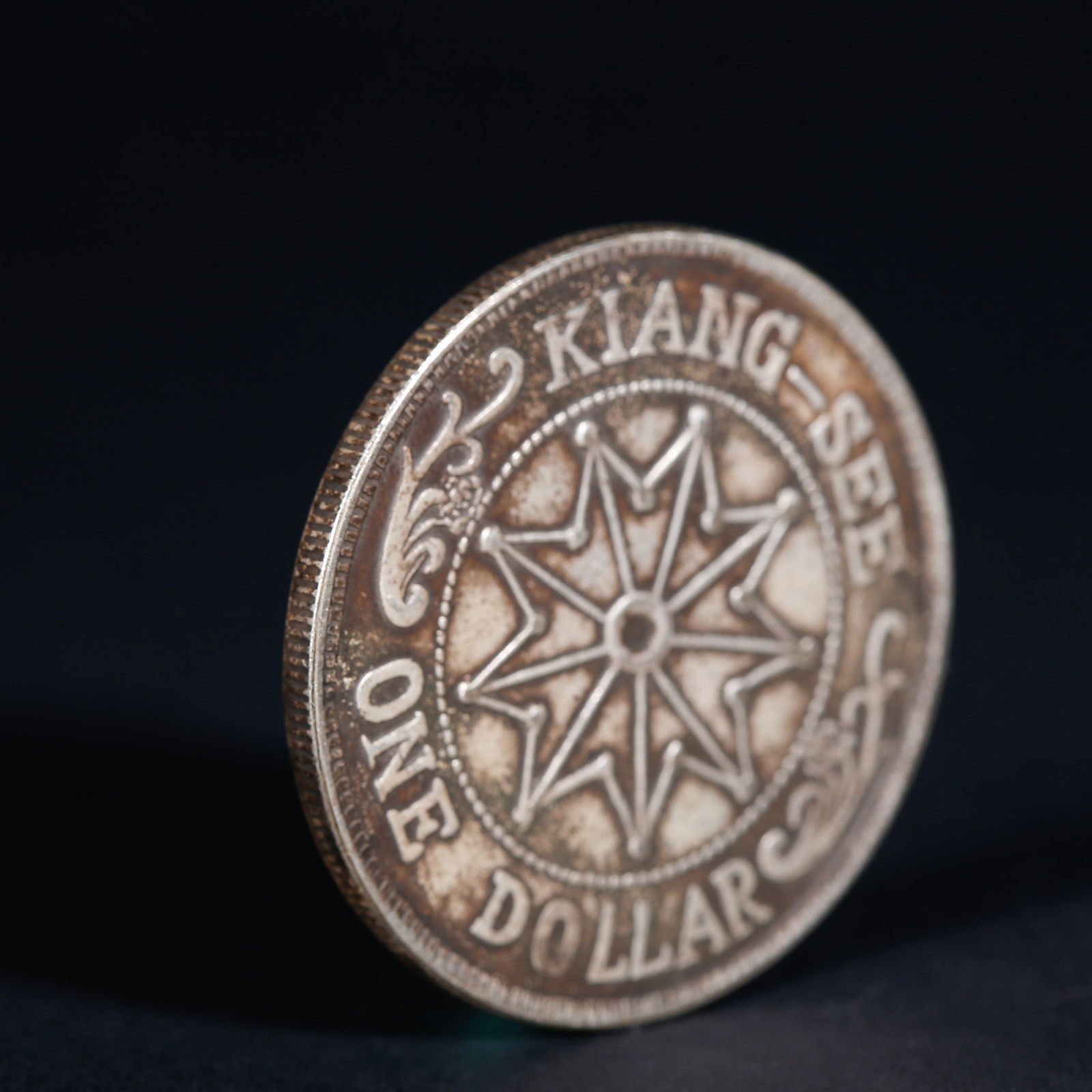 A SILVER DOLLAR COIN - 3