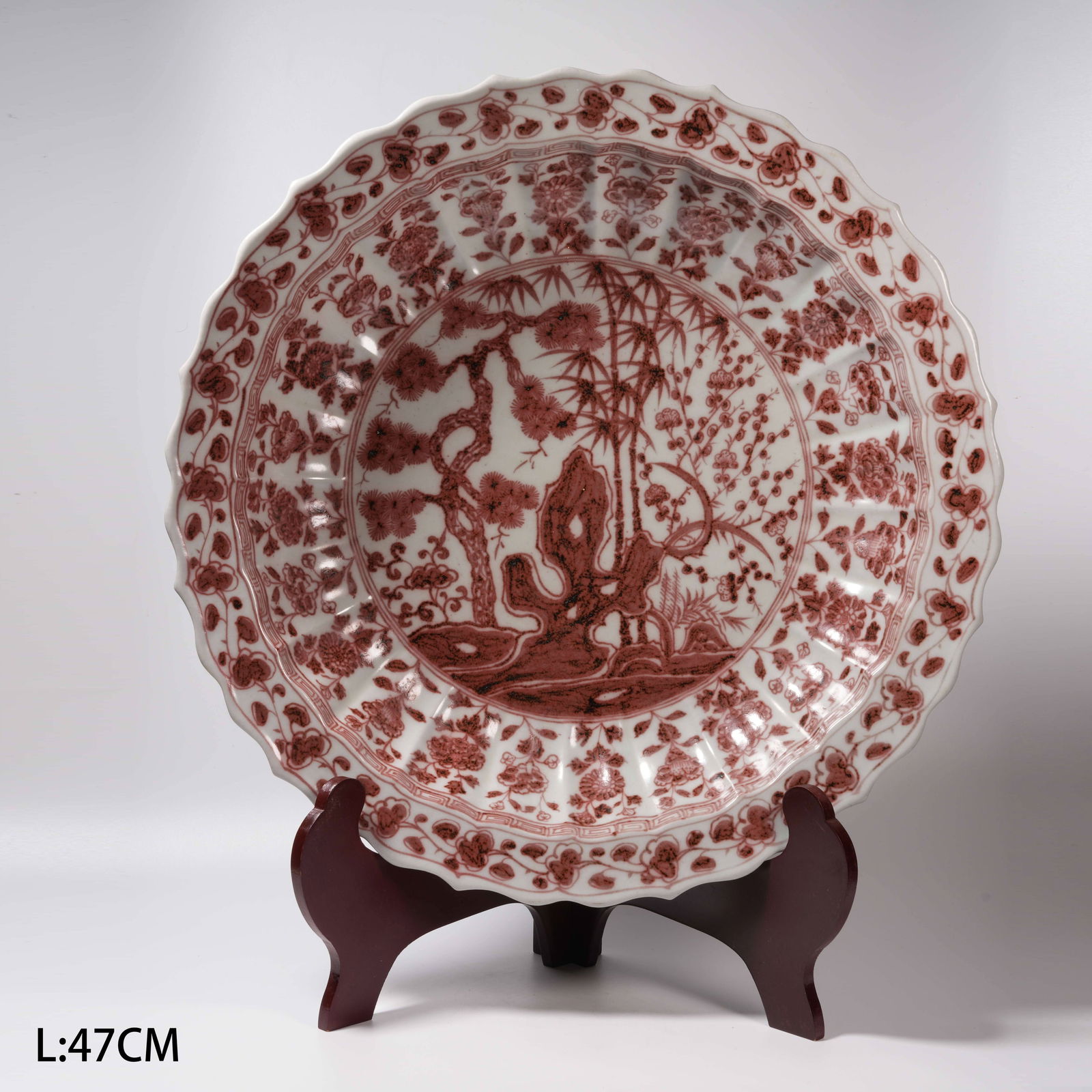 A IRON-RED SCHOLAR’S ROCK AND FLORAL FLARED-RIM DISH: Iron-Red Scholar’s Rock and Floral Flared-Rim Dish