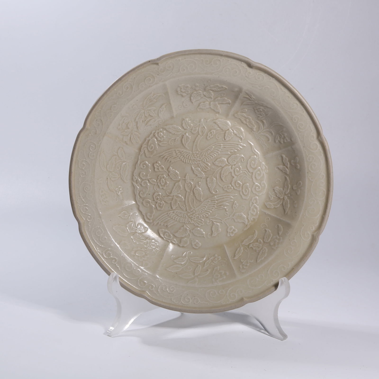 A DING KILN CARVED PIERCED PHOENIX-PATTERN DISH: Ding kiln carved pierced phoenix-pattern dish