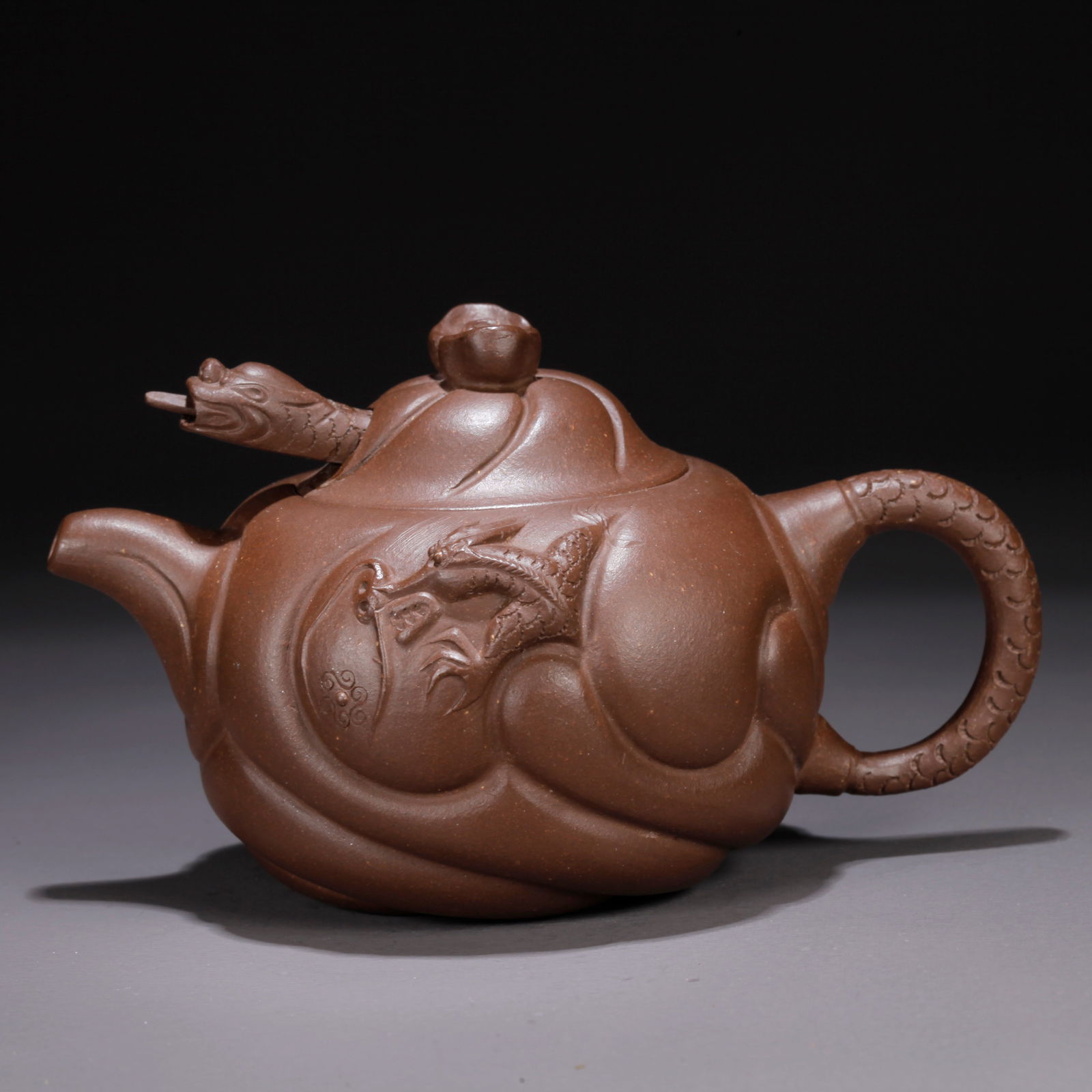 A PURPLE CLAY (ZISHA) "FISH TRANSFORMING INTO DRAGON" TEAPOT: Purple Clay (Zisha) "Fish Transforming into Dragon" Teapot