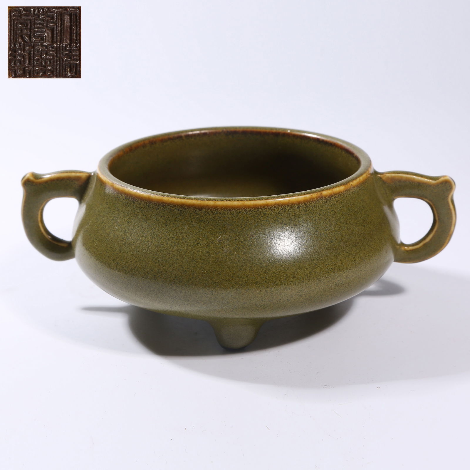 A TEA-DUST GLAZE TRIPOD DOUBLE-HANDLED CENSER: Tea-dust glaze tripod double-handled censer
