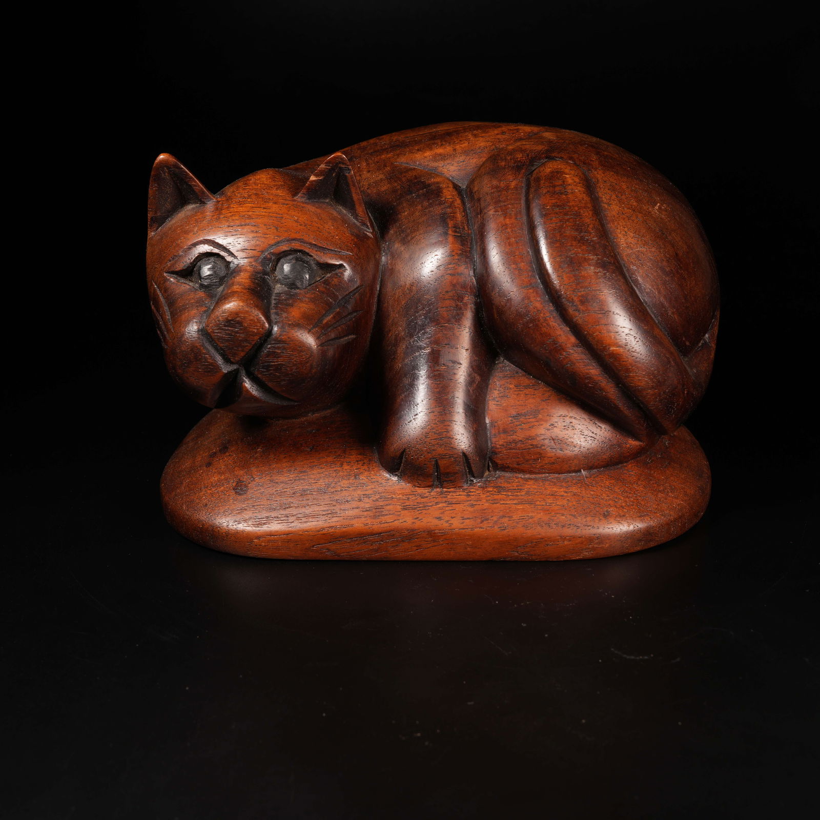 A HUANGHUALI WOOD CAT ORNAMENT: Huanghuali Wood Cat Ornament