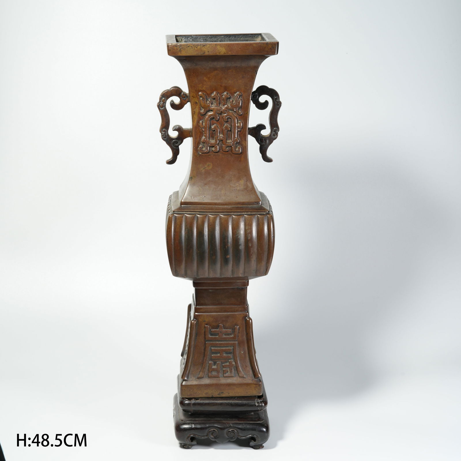 A BRONZE DOUBLE-HANDLED FLOWER-FORM VASE: Bronze Double-Handled Flower-Form Vase