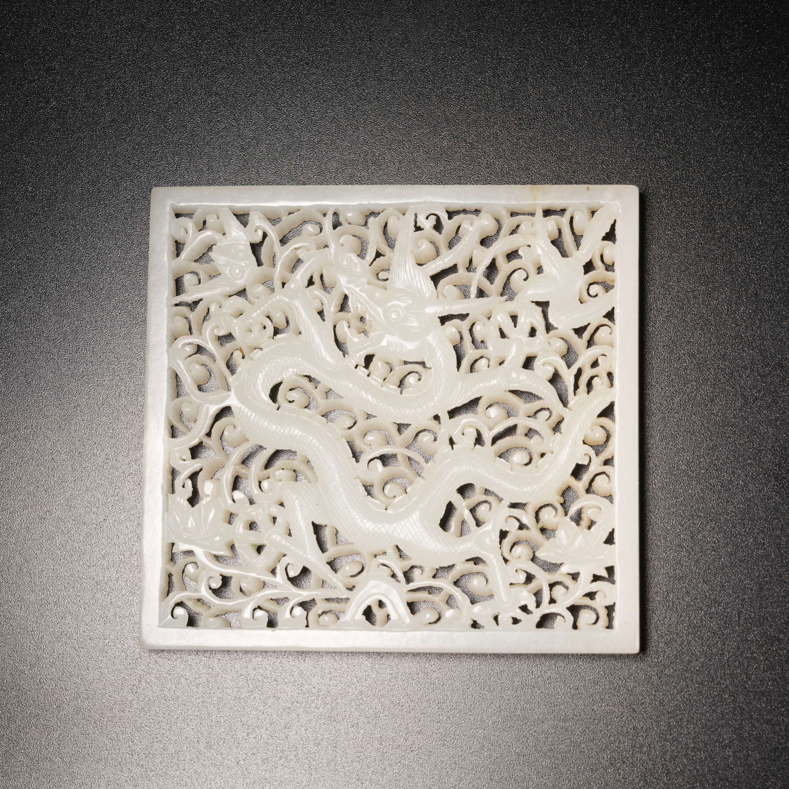 A HETIAN JADE FLOWER PIECE WITH OPENWORK DRAGON PATTERN: Hetian Jade Flower Piece with Openwork Dragon Pattern
