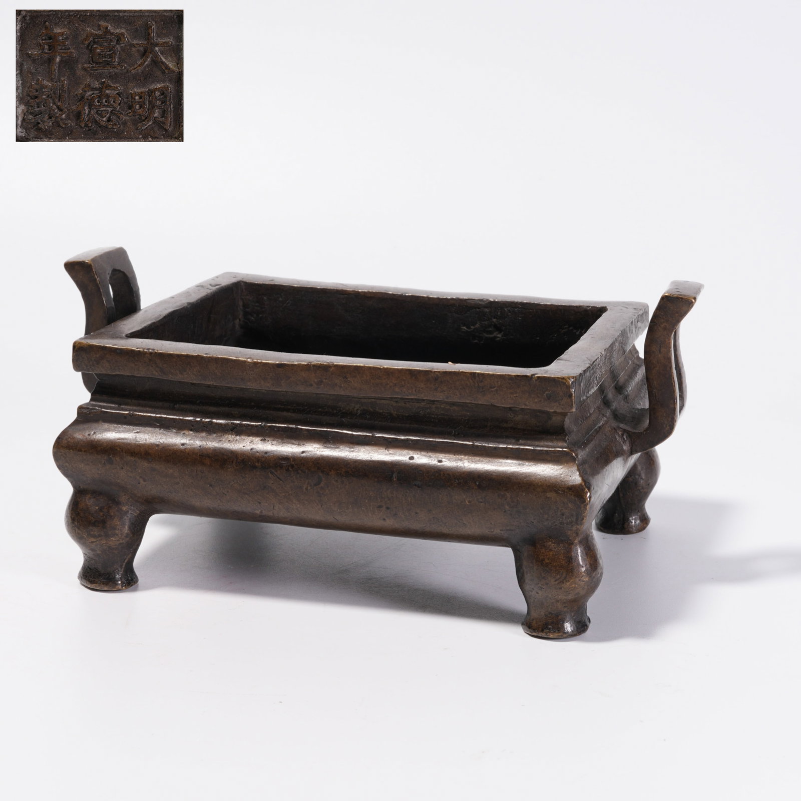 A BRONZE CENSER WITH UPTURNED HANDLES: Bronze Censer with Upturned Handles