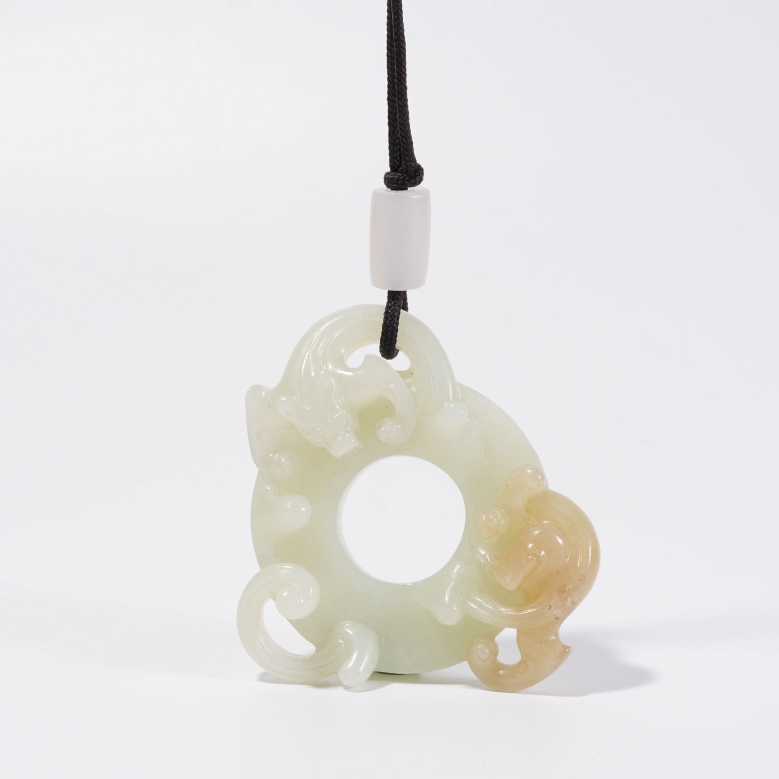 A HETIAN JADE DRAGON PATTERN DISC (1 of 11)