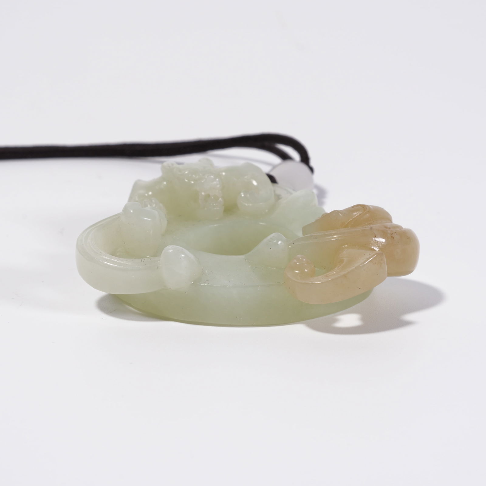 A HETIAN JADE DRAGON PATTERN DISC - 9