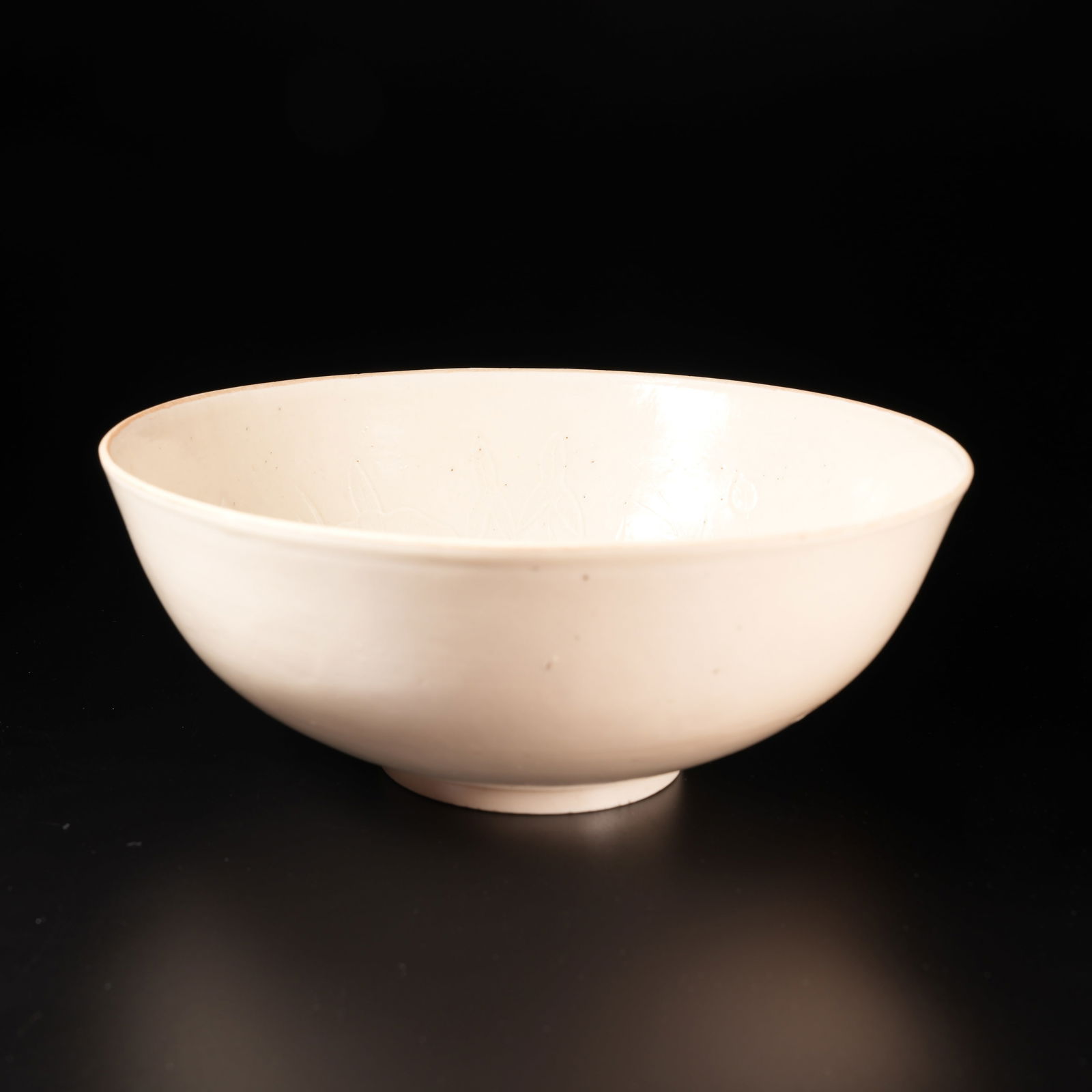 A DING KILN BOWL WITH INCISED FLOWER PATTERN: Ding Kiln Bowl with Incised Flower Pattern