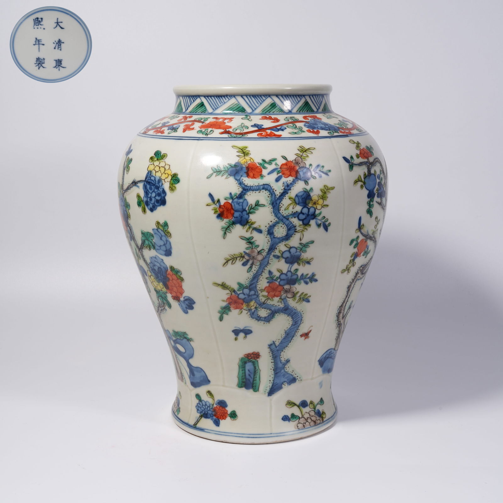 A FAMILLE ROSE JAR WITH FLOWER-AND-PLANT PATTERN: Famille Rose Jar with Flower-and-Plant Pattern