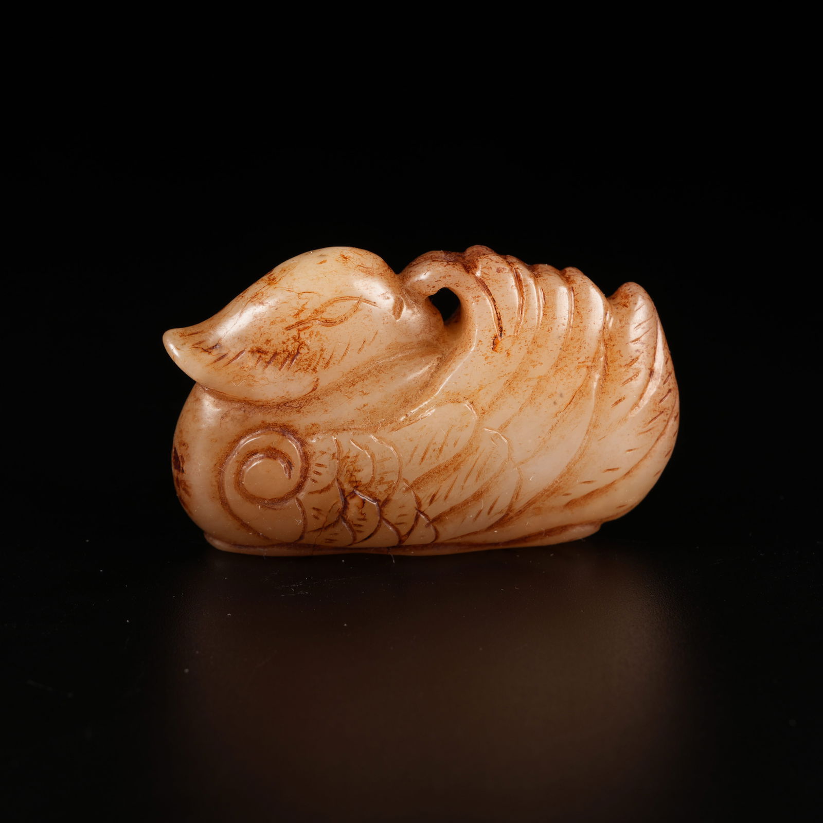 A DIVINE PHOENIX ORNAMENT IN ARCHAIC JADE: Divine Phoenix Ornament in Archaic Jade