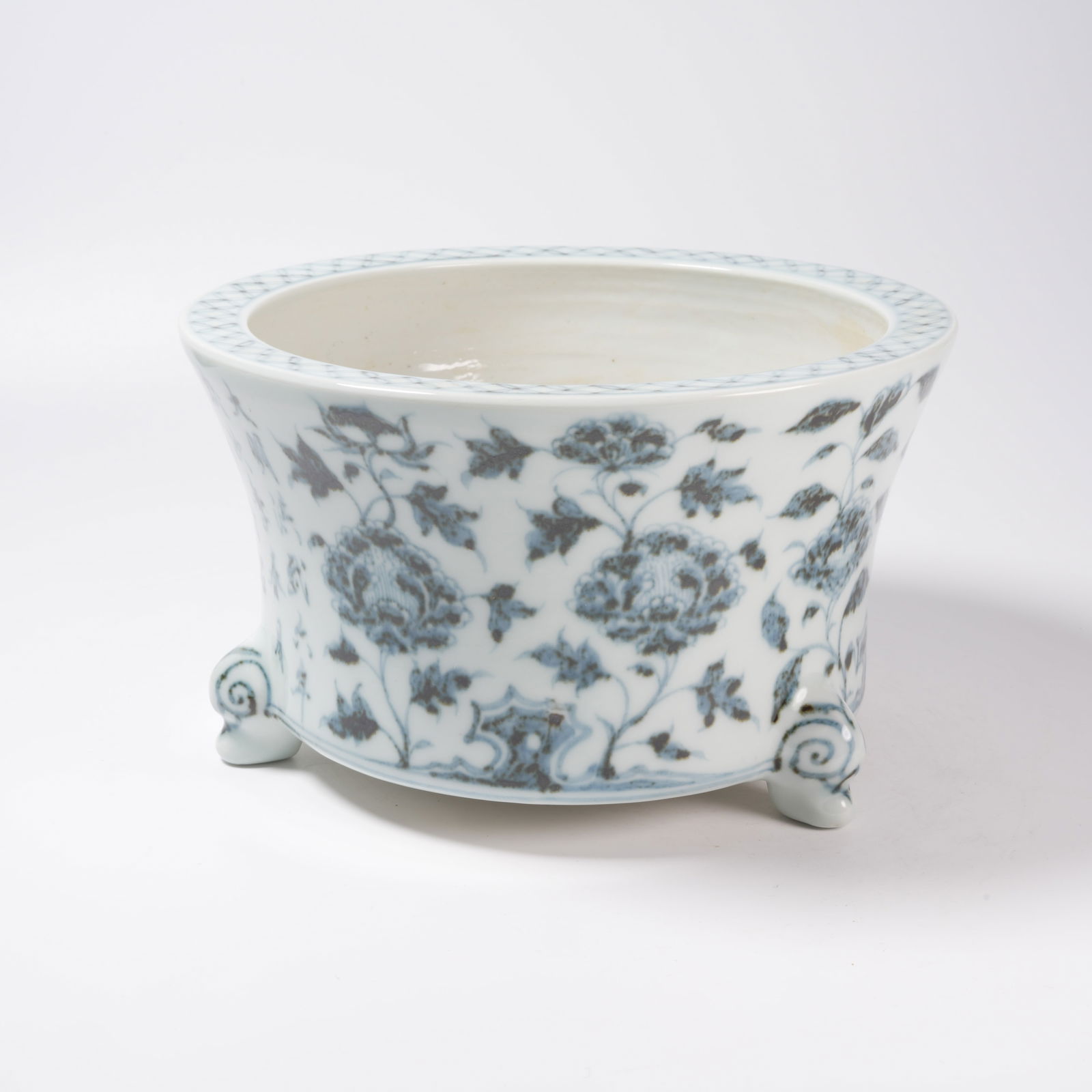 A BLUE-AND-WHITE FLORAL TRIPOD INCENSE BURNER: Blue-and-White Floral Tripod Incense Burner