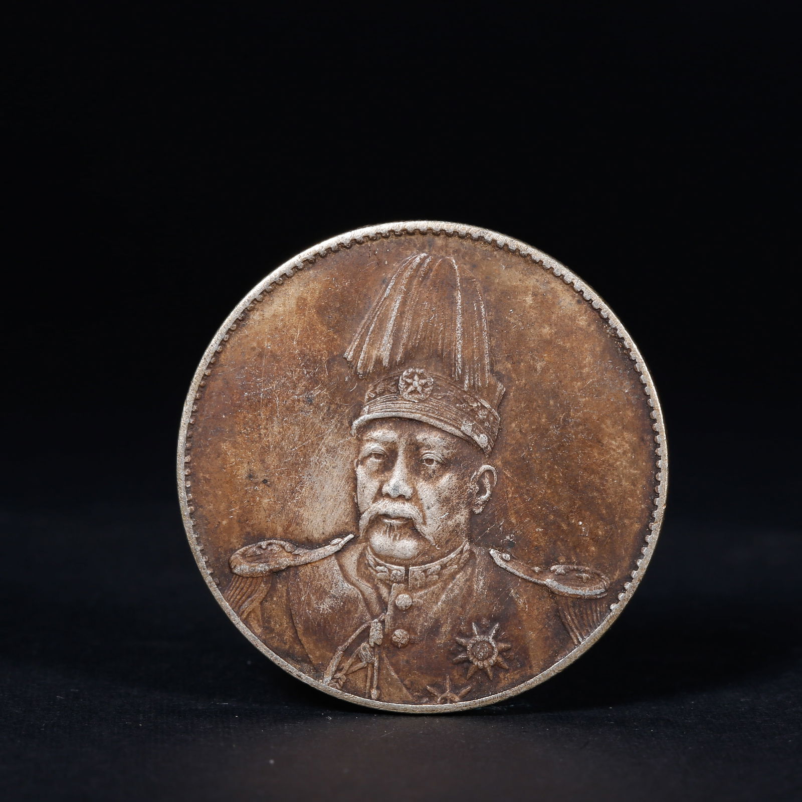 A SILVER DOLLAR COIN: One Silver dollar Coin