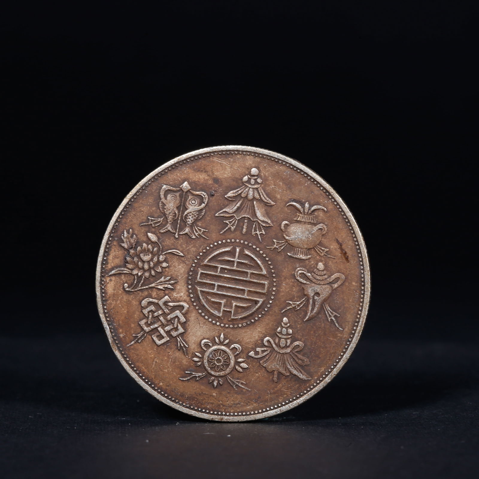 A SILVER DOLLAR COIN - 2