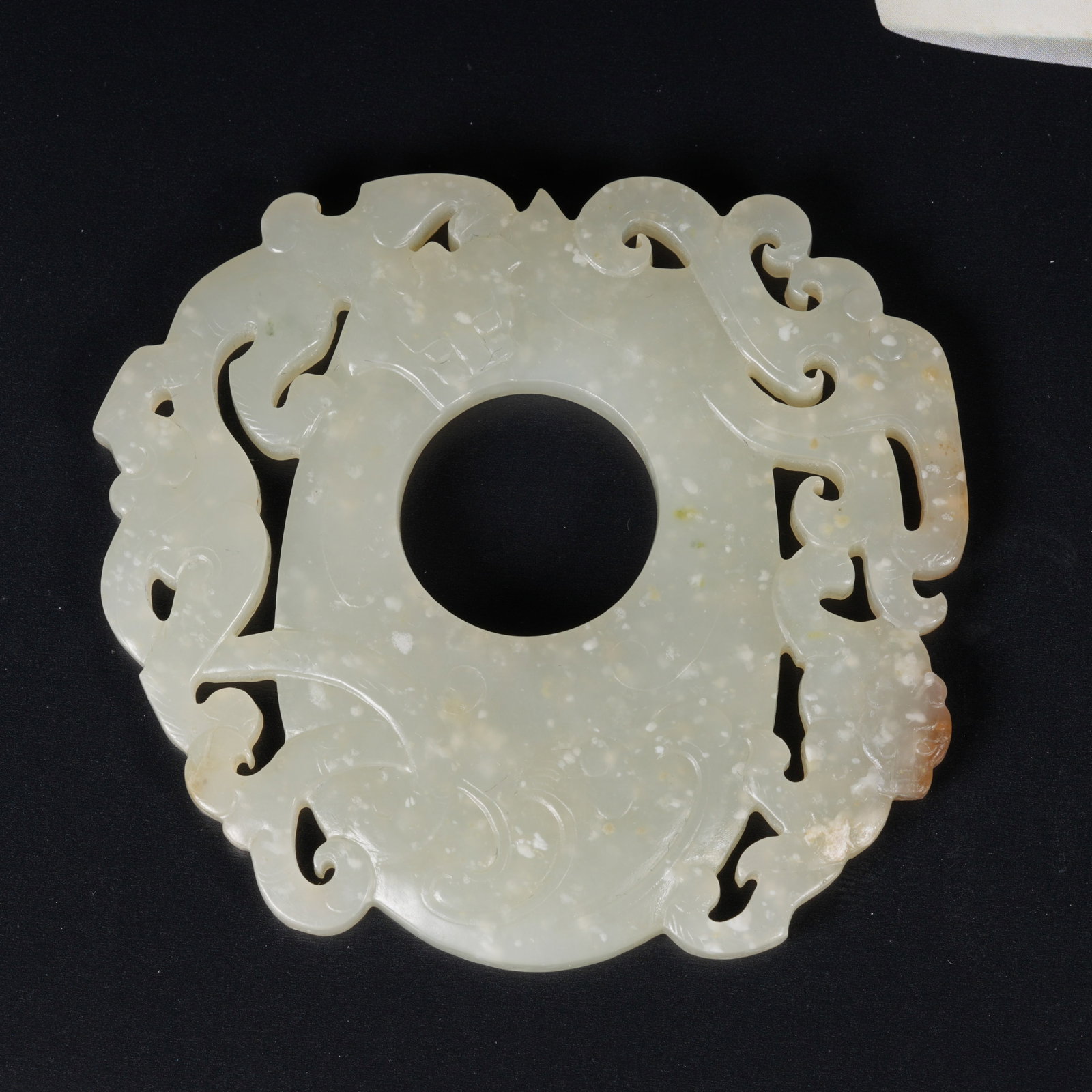 A HETIAN JADE CHICKEN-HEART PENDANT: Hetian Jade Chicken-Heart Pendant