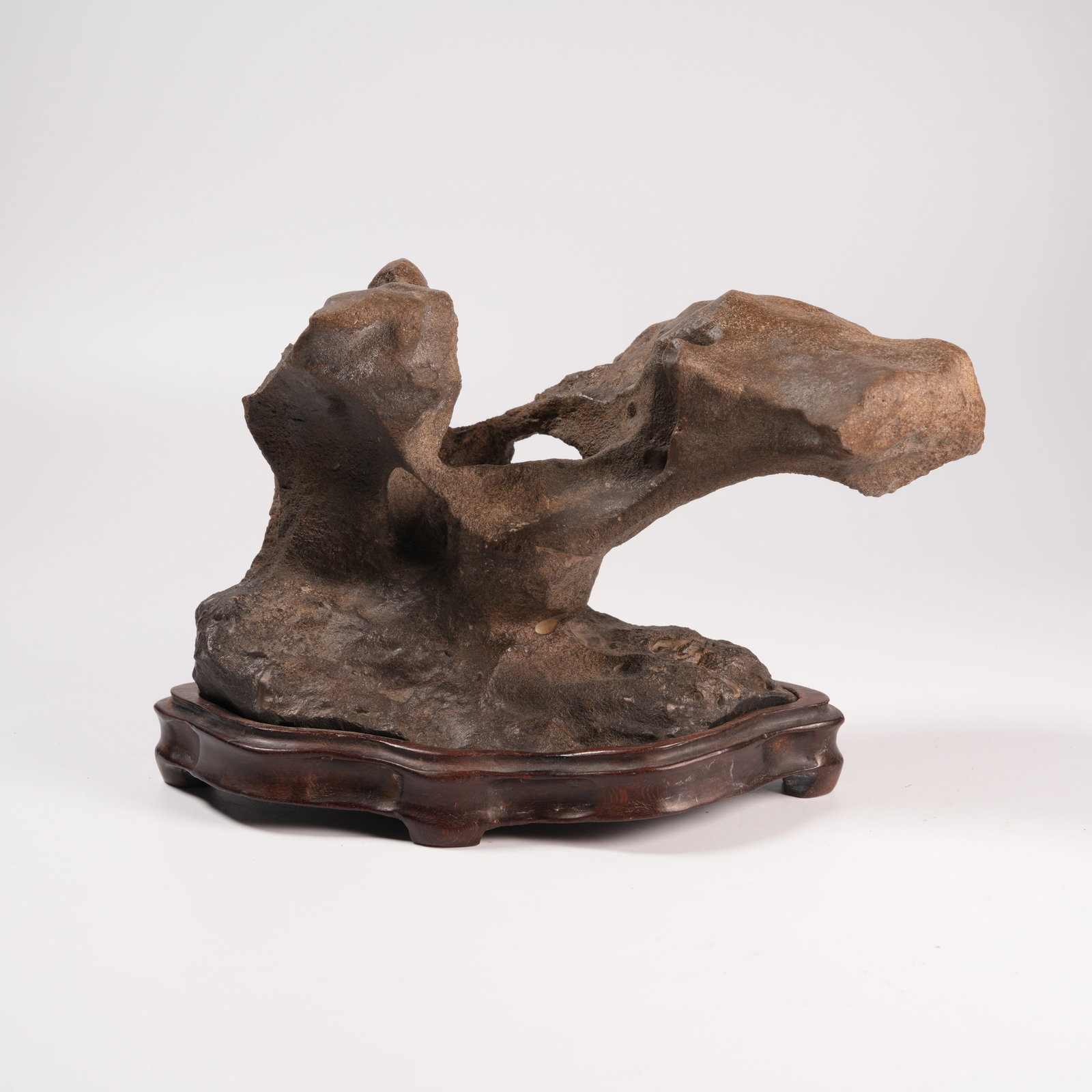 A STONE MOUNTAIN-FORM ORNAMENT: Stone Mountain-Form Ornament