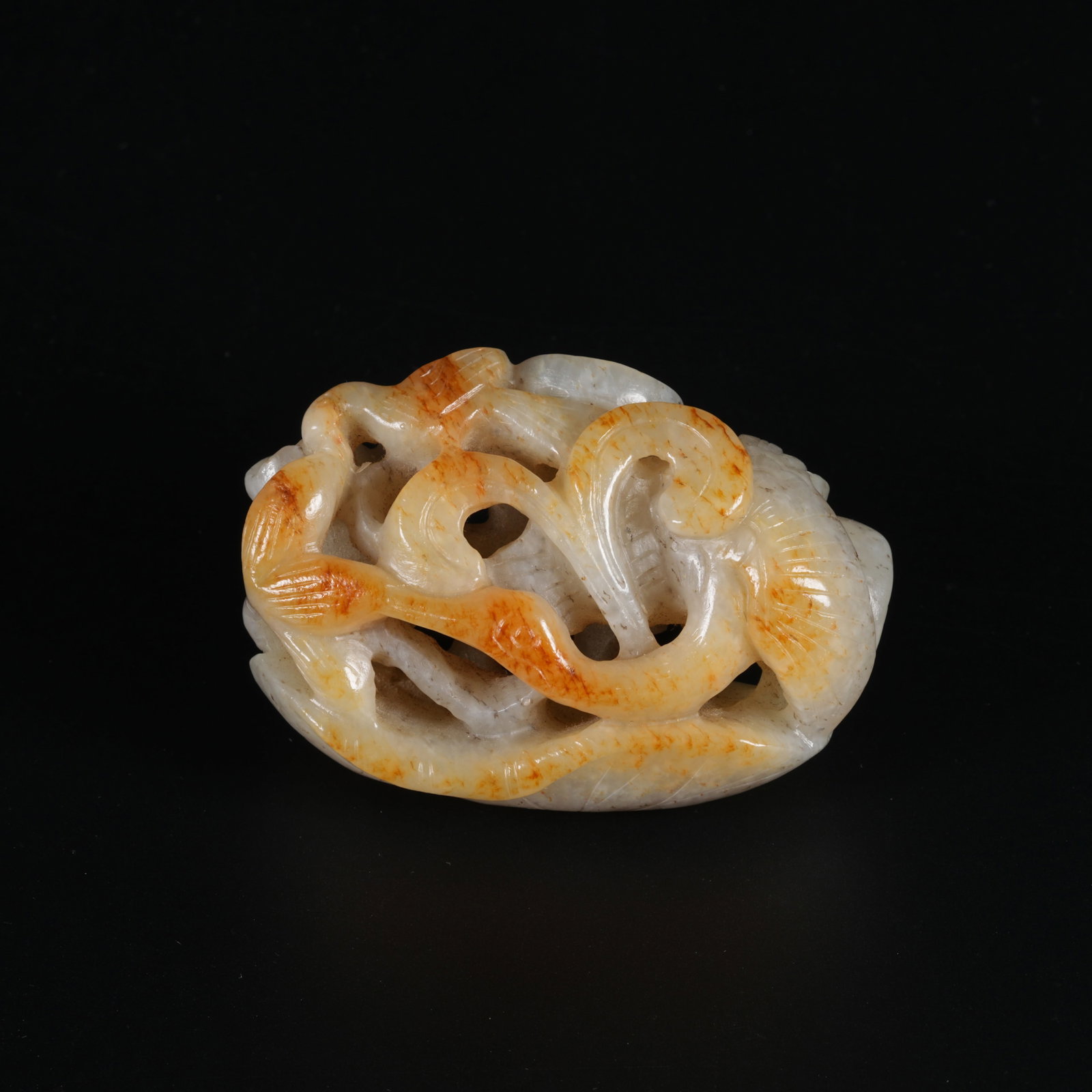 A HETIAN JADE PENDANT WITH LOTUS LEAF MOTIF (1 of 8)