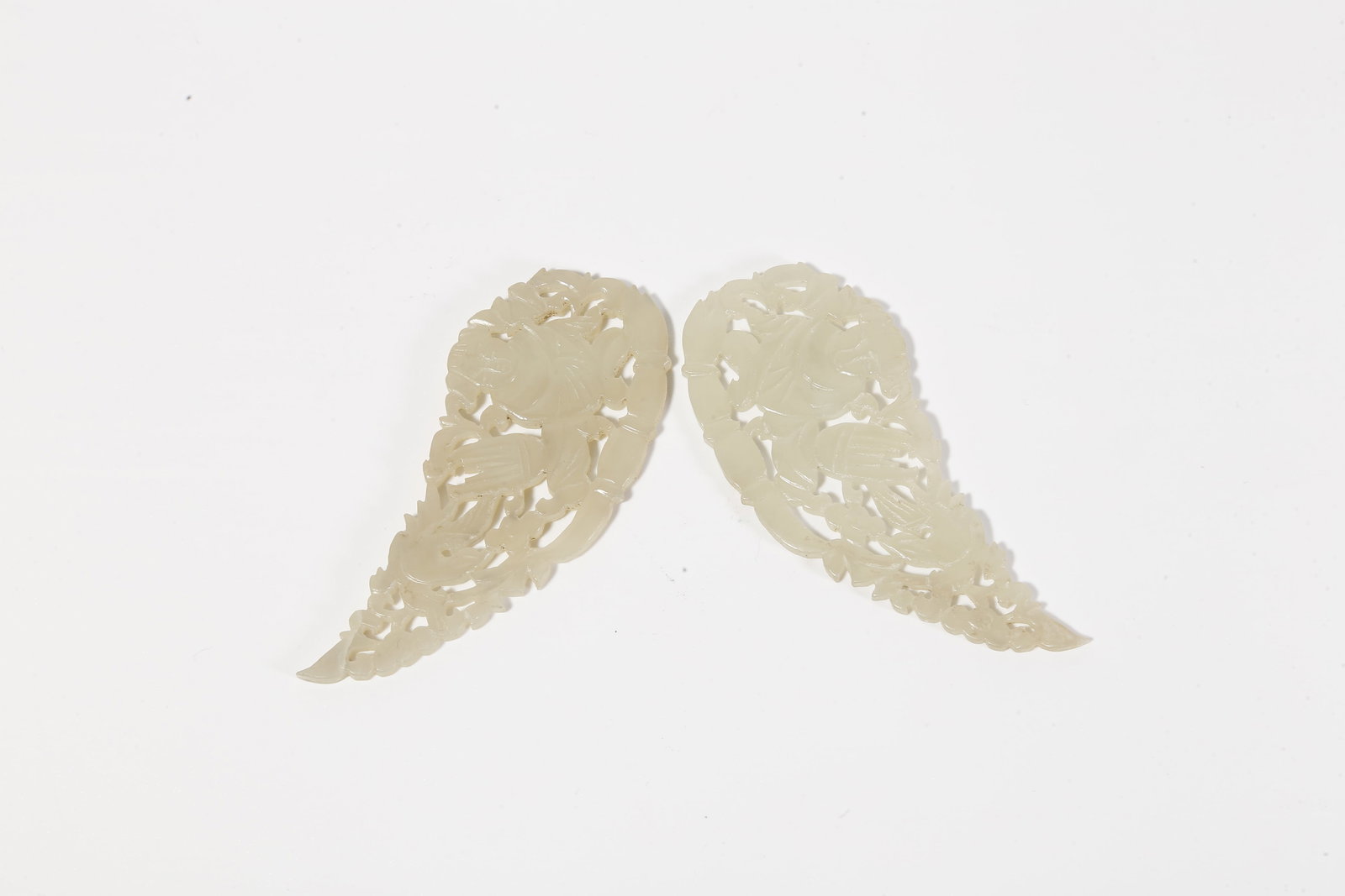 A HETIAN JADE CARVED BOY MOTIF PENDANT (PAIR): Hetian Jade Carved Boy Motif Pendant (Pair)