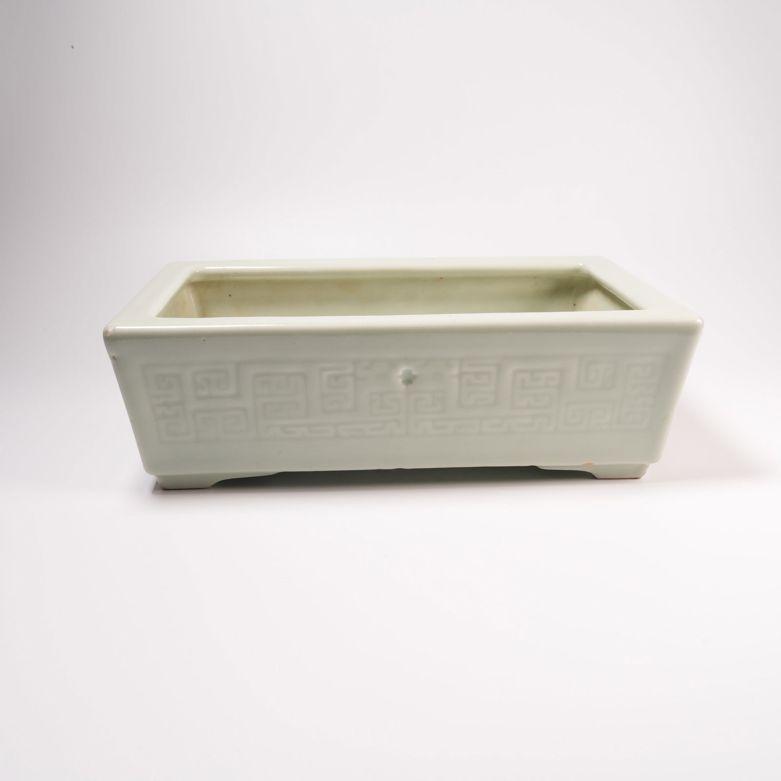 A FAMILLE-ROSE GLAZED NARCISSUS BASIN WITH CURVED DRAGON MOTIF: Famille-Rose Glazed Narcissus Basin with Curved Dragon Motif