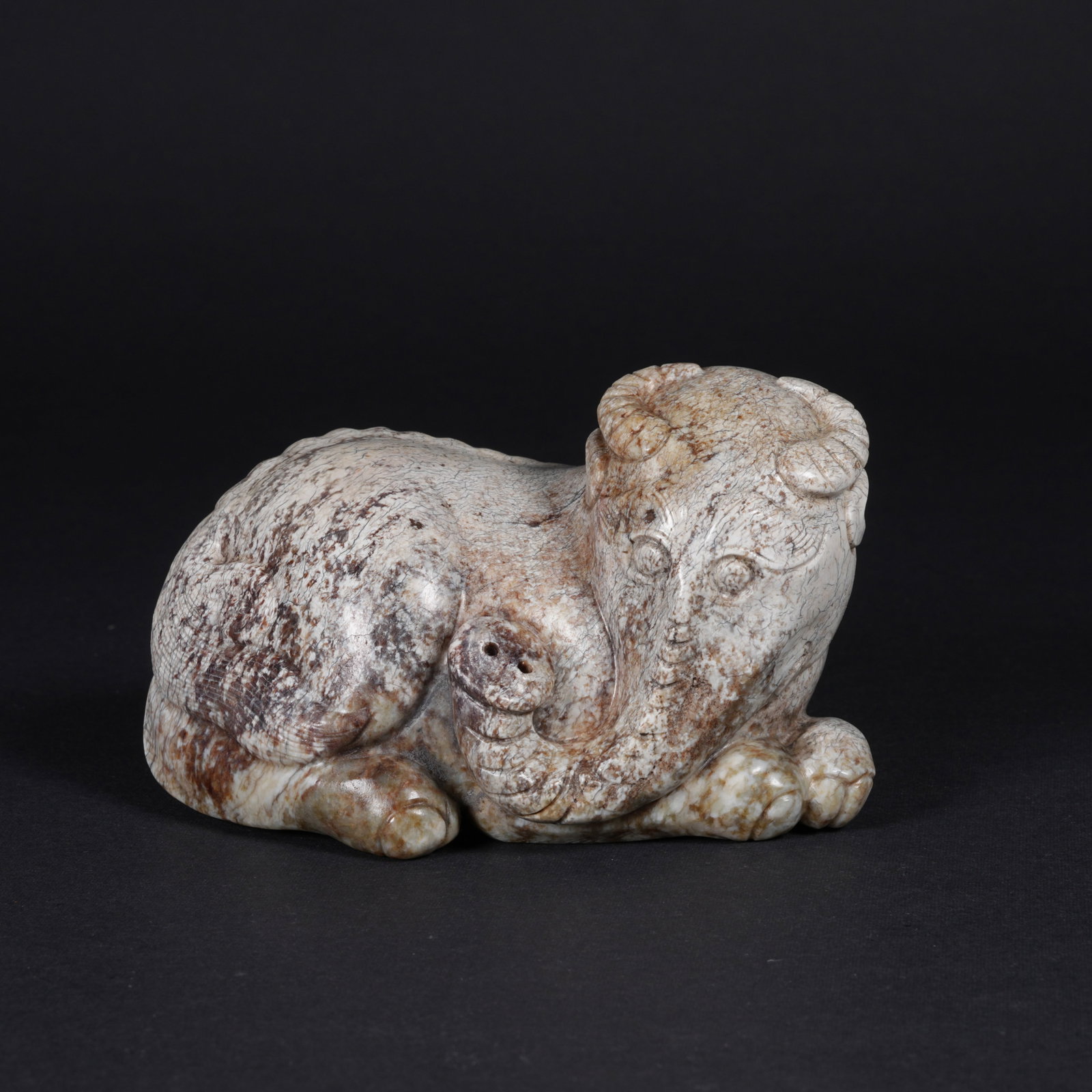 A ARCHAIC JADE AUSPICIOUS BEAST FIGURINE (1 of 9)