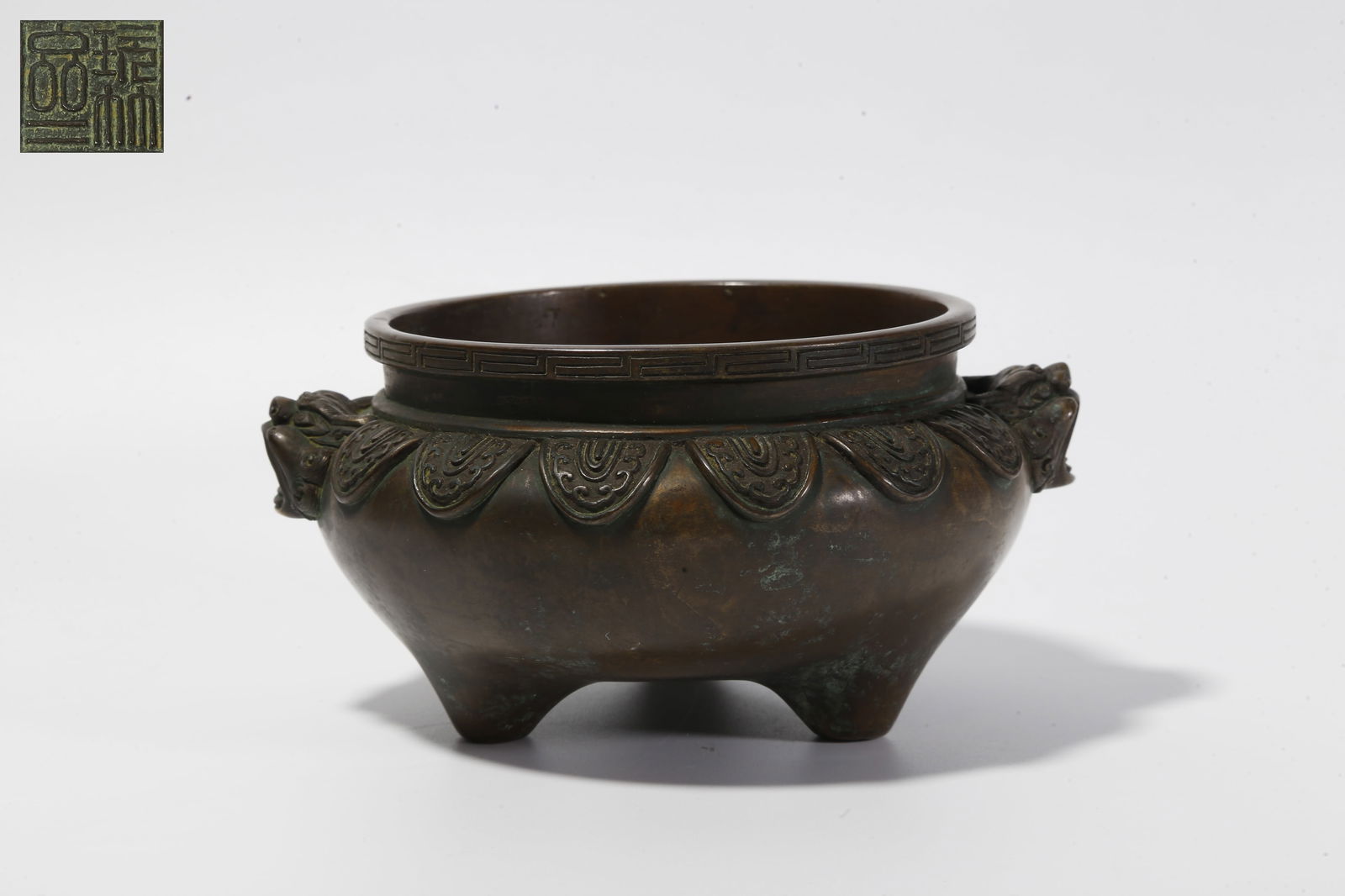 A BRONZE DOUBLE-BEAST-HANDLED INCENSE BURNER: Bronze Double-Beast-Handled Incense Burner