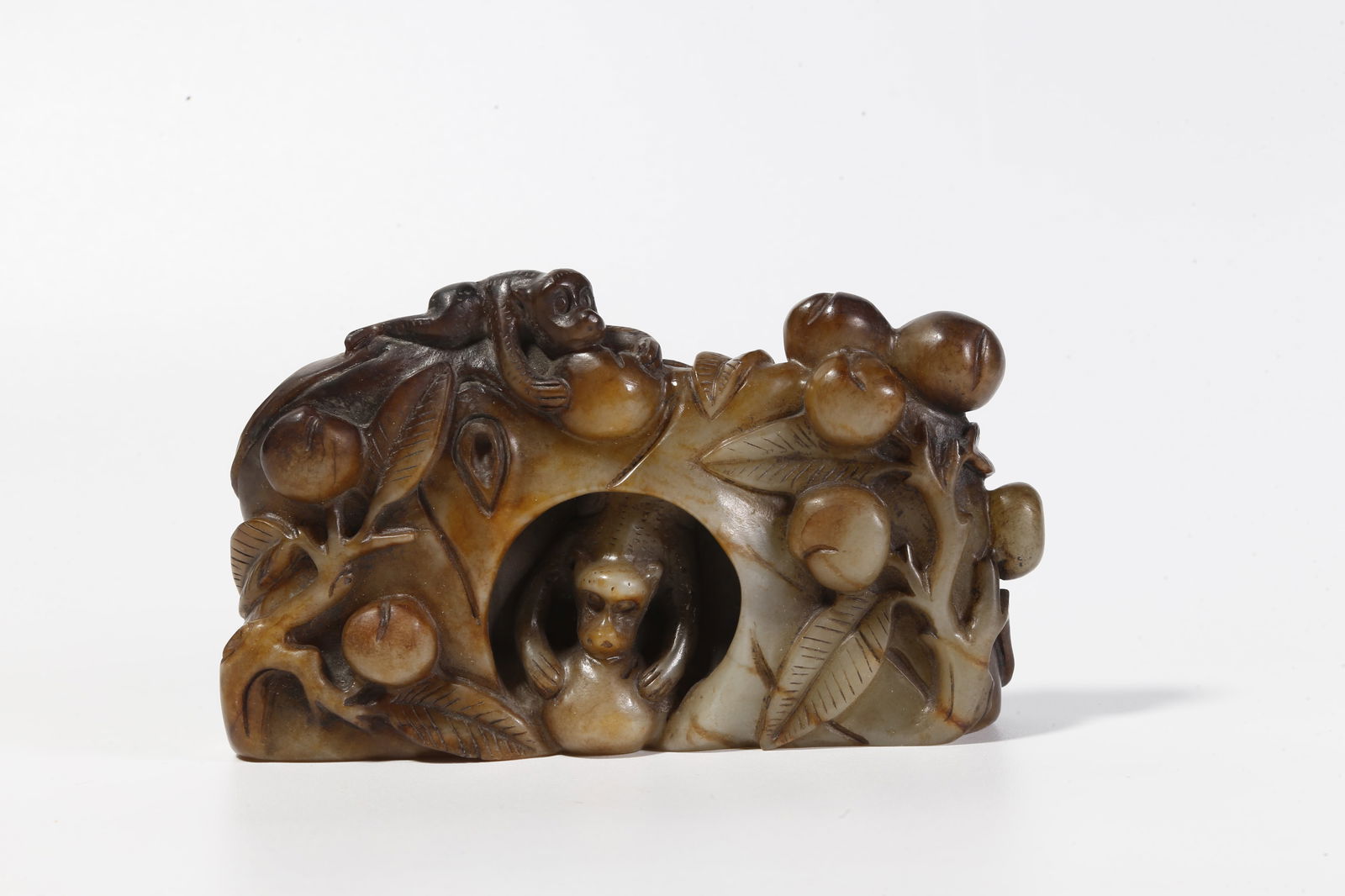 A HETIAN JADE CARVED MONKEY FIGURINE: Hetian Jade Carved Monkey Figurine