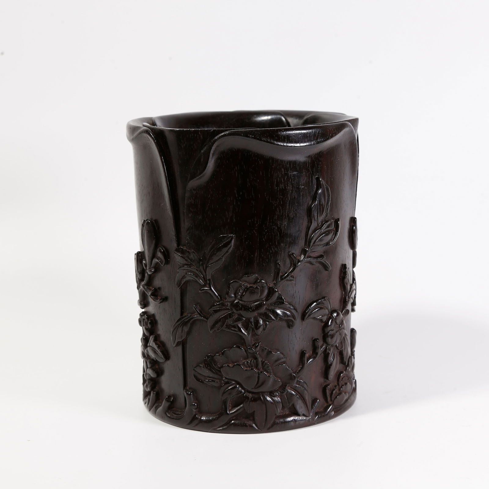 A ZITAN WOOD CARVED ARMREST WITH FLORAL MOTIF: Zitan wood carved armrest with floral motif