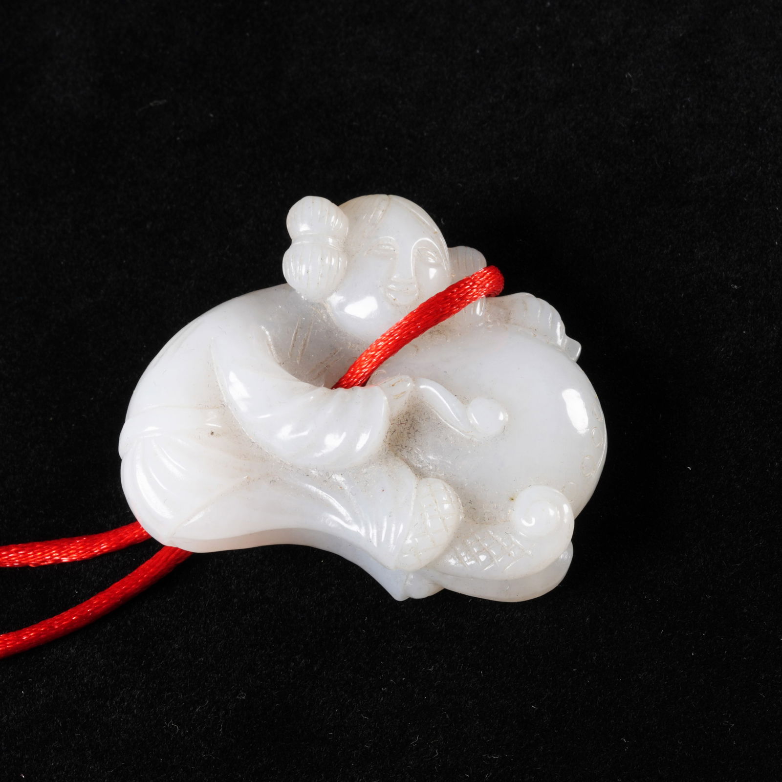 A HETIAN JADE BOY PENDANT: Hetian jade boy pendant