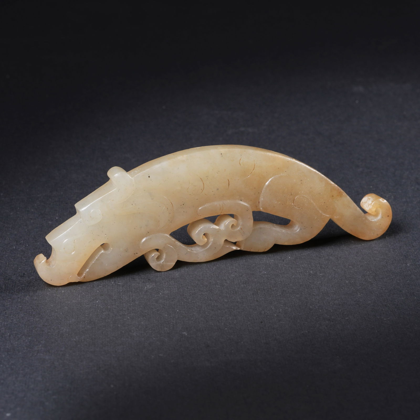 A HETIAN JADE MYTHICAL-BEAST PENDANT (1 of 6)