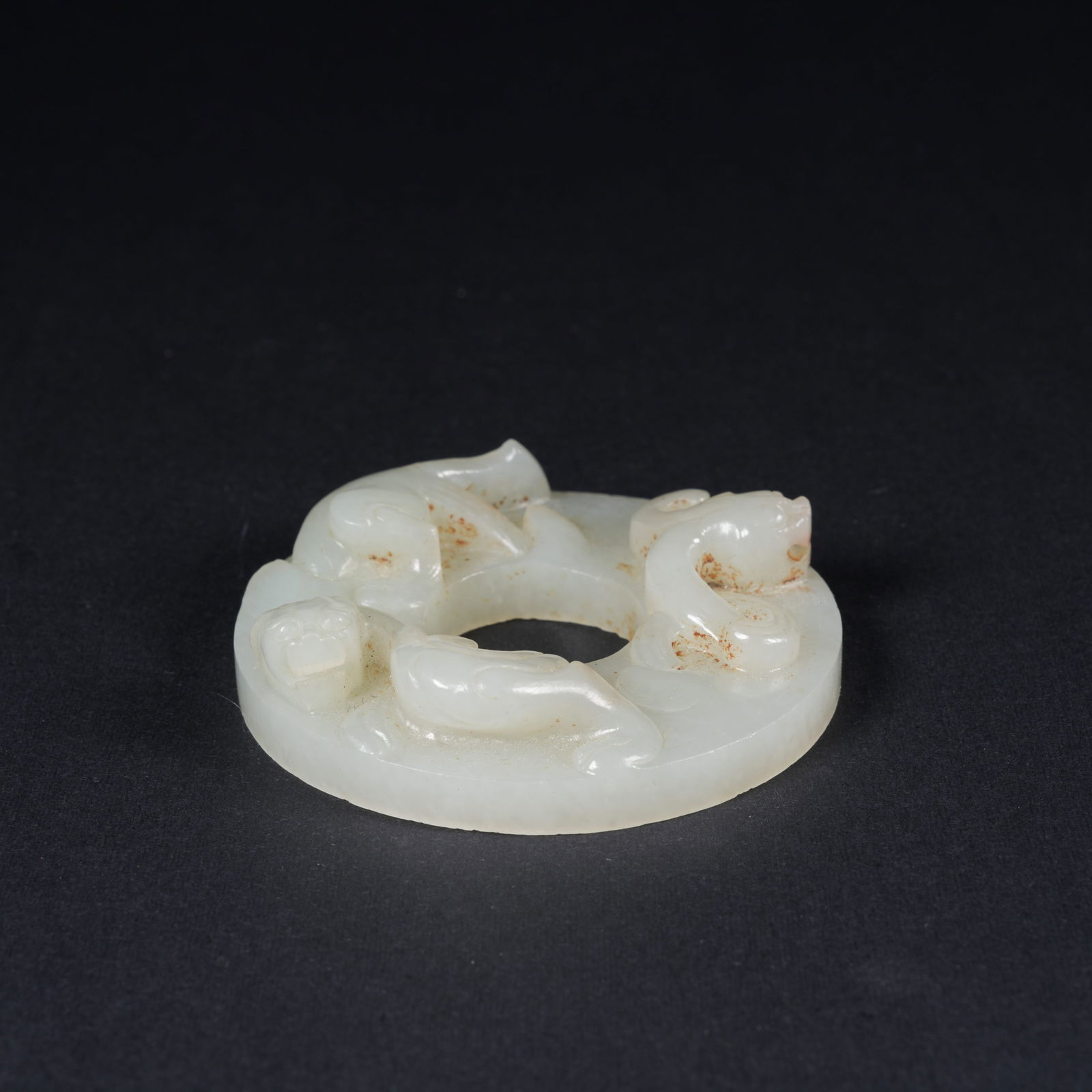 A HETIAN JADE BI DISC WITH CHI DRAGON MOTIF: Hetian jade bi disc with chi dragon motif