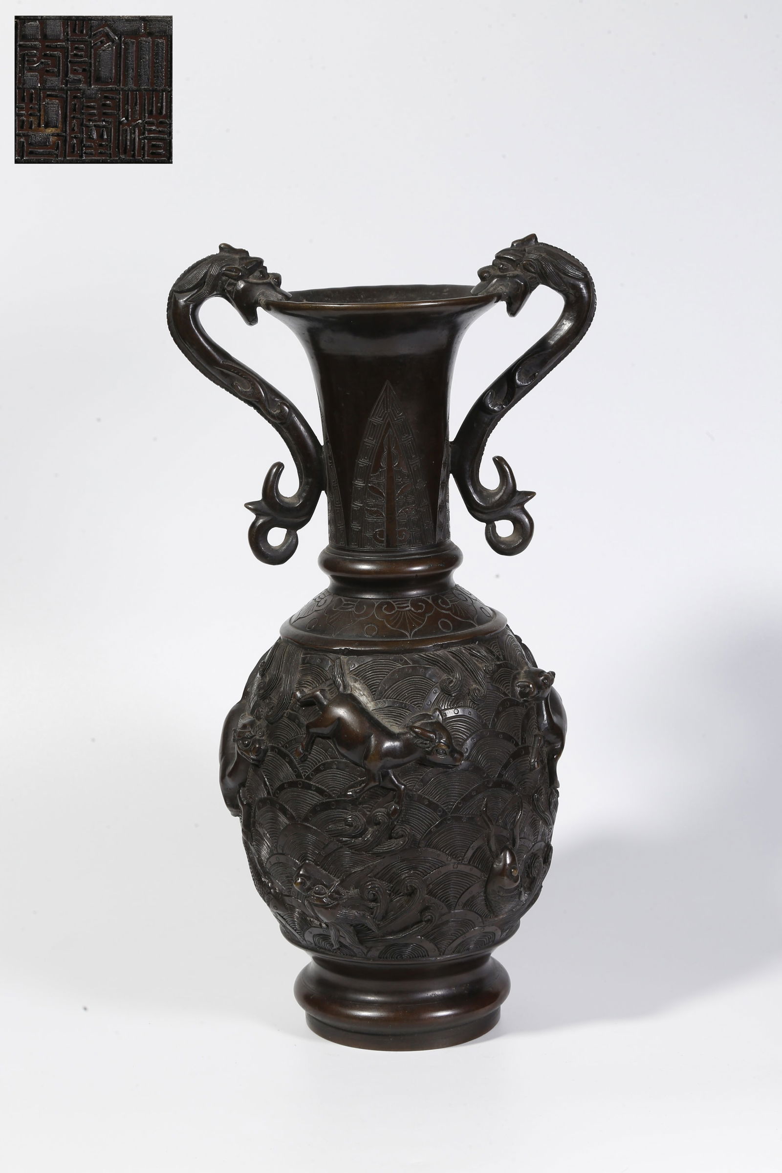 A BRONZE DOUBLE-DRAGON-HANDLED BOTTLE: Bronze double-dragon-handled bottle