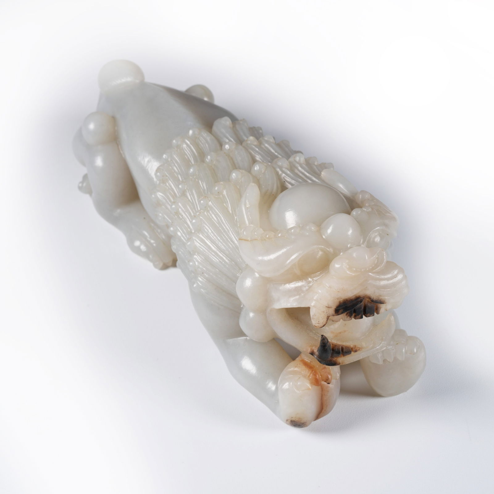 A HETIAN JADE LION ORNAMENT (1 of 8)