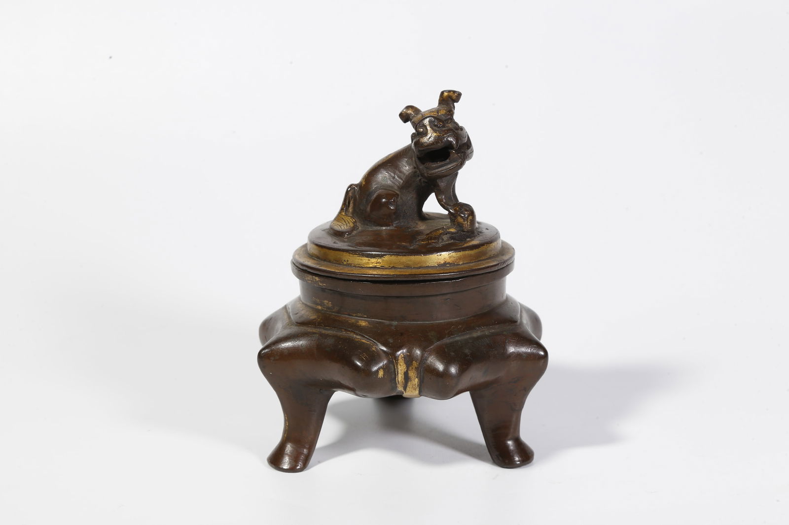 A BRONZE INCENSE BURNER WITH BEAST-SHAPED KNOP: Bronze incense burner with beast-shaped knop