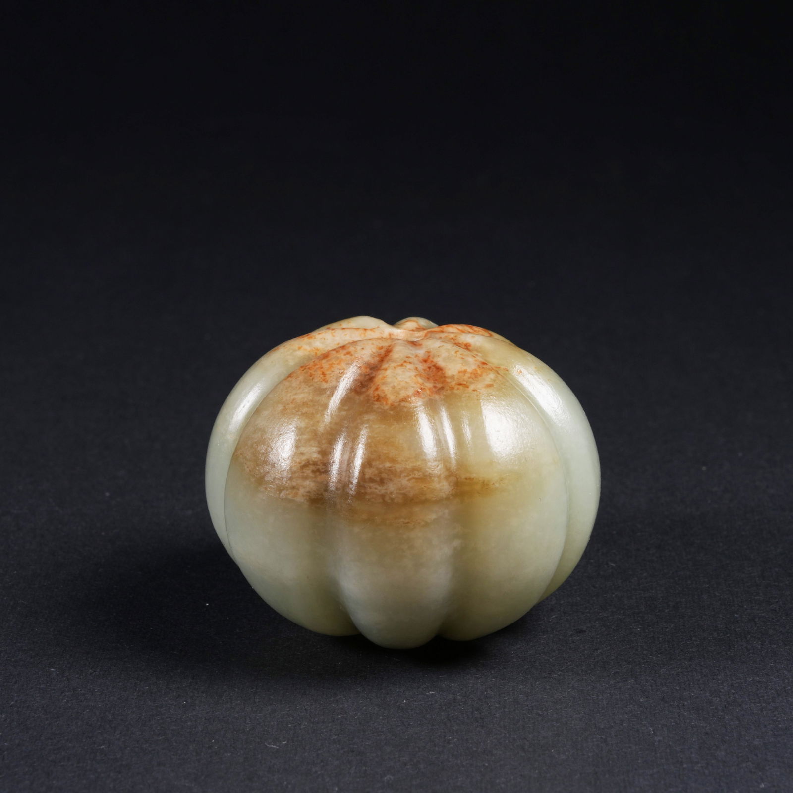 A HETIAN JADE FRUIT-AND-MELON PENDANT: Hetian jade fruit-and-melon pendant