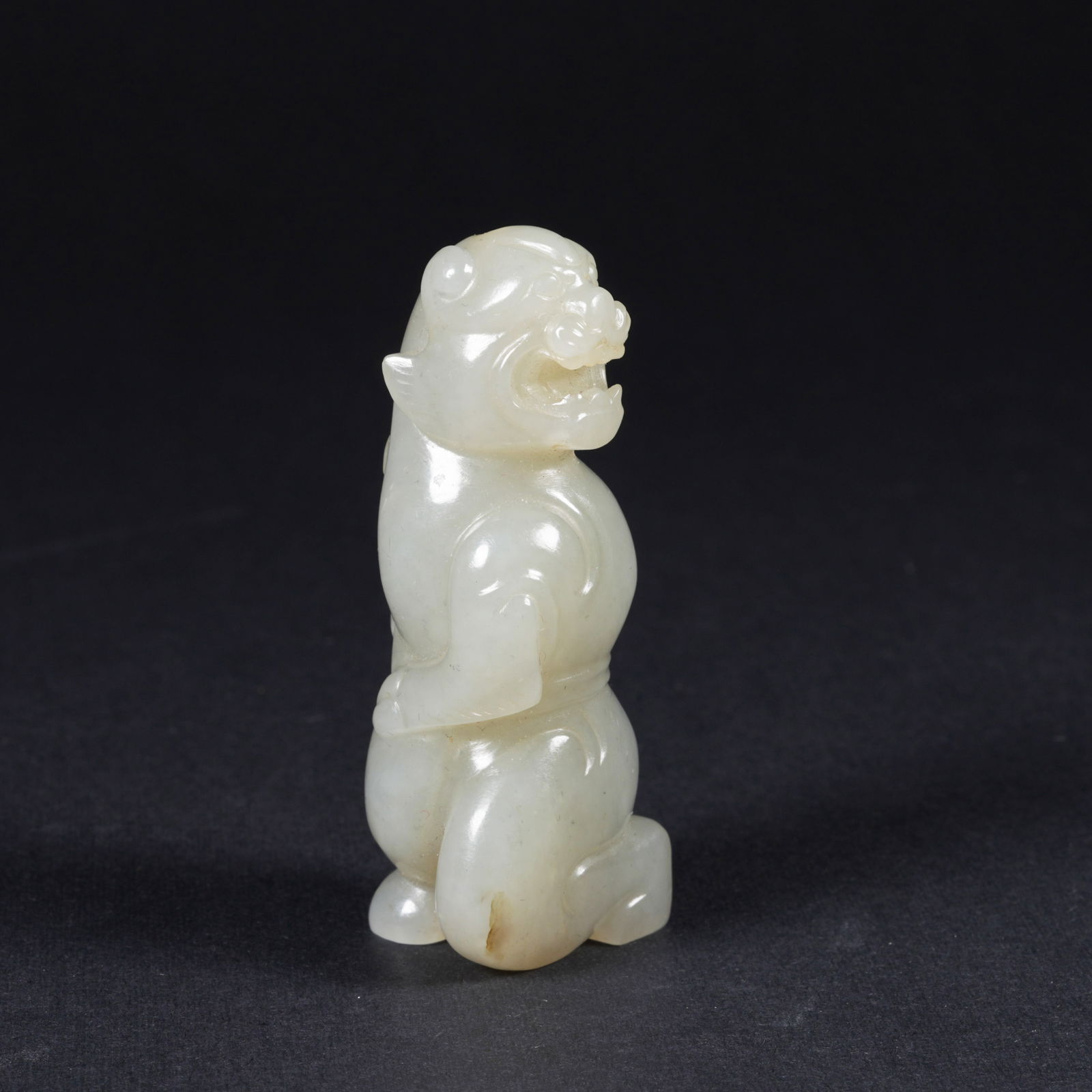 A HETIAN JADE MYTHICAL-BEAST ORNAMENT (1 of 8)