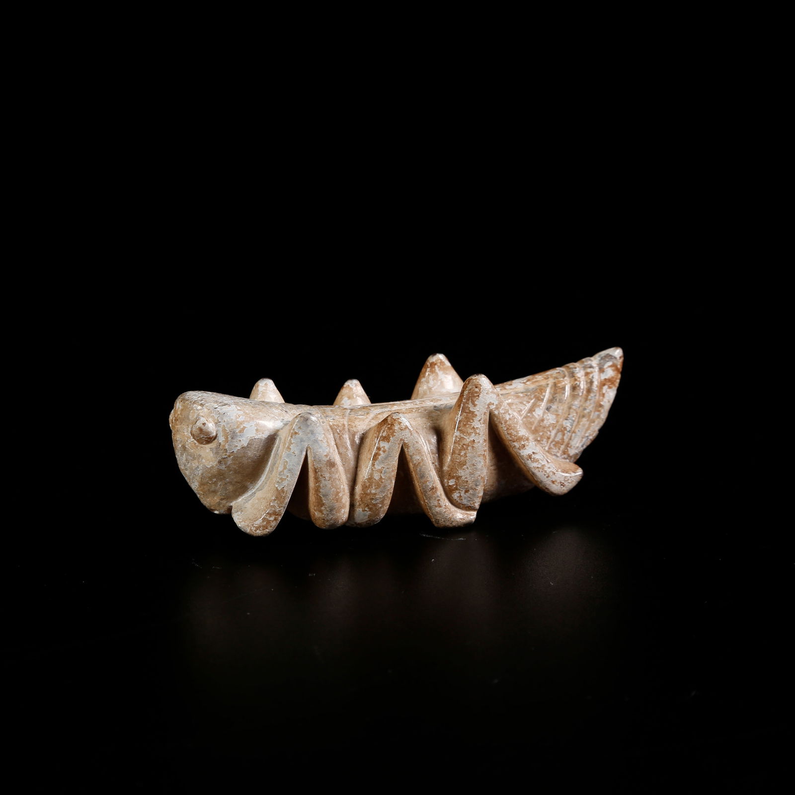 A ANCIENT JADE MANTIS-SHAPED ORNAMENT: Ancient jade mantis-shaped ornament