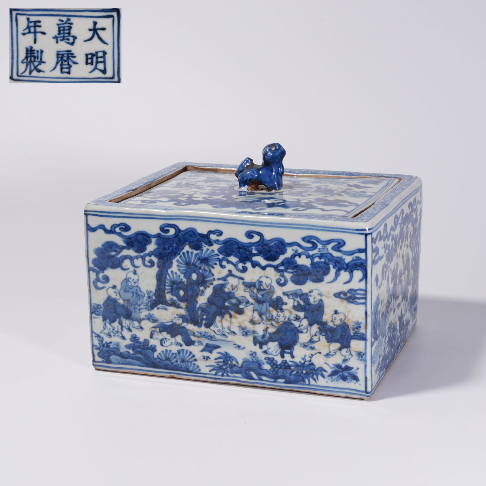 A BLUE-AND-WHITE INFANT PLAY MOTIF COVERED BOX: Blue-and-White Infant Play Motif Covered Box