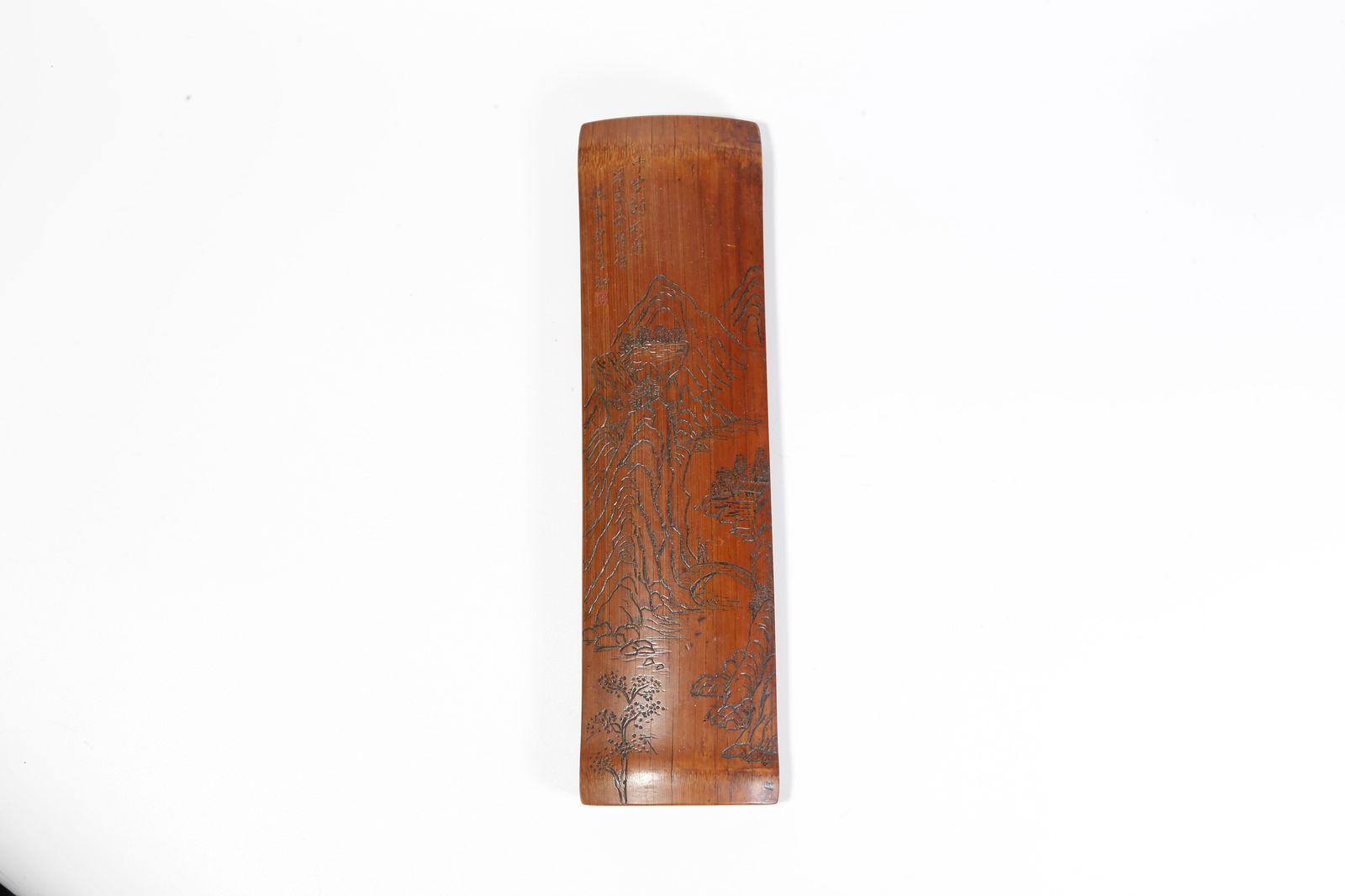 A BAMBOO-CARVED ARMREST WITH LANDSCAPE MOTIF: Bamboo-carved armrest with landscape motif
